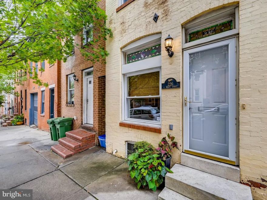 Beautiful recently remodeled Upper Fell's Point home in ideal location. Stained glass, hardwood floors and an open layout greet you upon entry. The house flows wonderfully from spacious living room to nice size dining area to charming kitchen to intimate outdoor courtyard. Upstairs you will find 2 bedrooms and 2 full baths (one brand new hall full bath and one en suite full bath) on the  second level, and then an extra large bedroom on the third floor.  The house has historic charm and modern and updated amenities. Main floor laundry is convenient. This location is very walkable to many area restaurants and popular destinations.  It is a short walk up to the Hopkins and Kennedy Krieger campuses and down to the waterfront, Fell's Point and Harbor East.  This home is a must see especially at this price point!