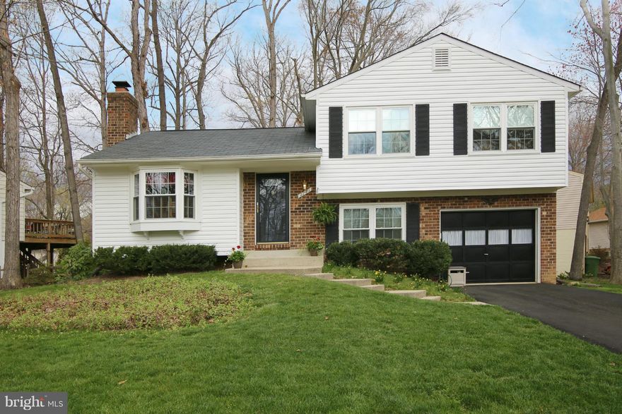 Immaculately maintained 4 level split on a private cul de sac in Lake Ridge. Open airy floor plan perfect for entertaining. Fabulous eat in kitchen with 42" maple cabinets, Silestone counters, stainless appliances and breakfast bar opens to spacious deck overlooking wooded, fenced back yard. Walk to schools and shopping. Enjoy the neighborhood pools, trails, playgrounds and convenient commute too!