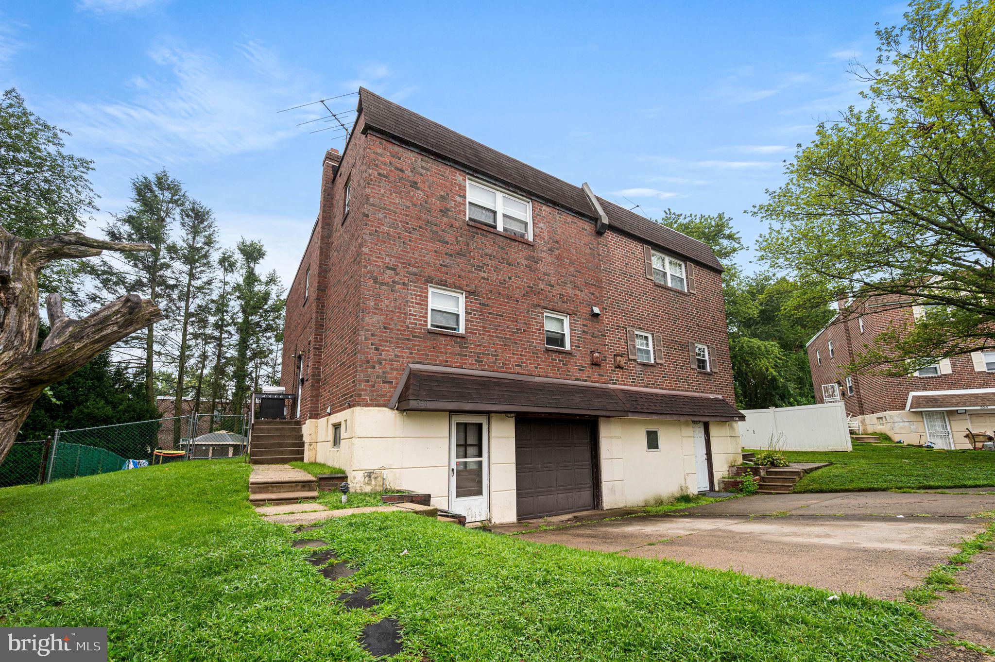 Welcome to 358 Tomlinson Terrace, a spacious, twin townhome tucked away on a peaceful cul-de-sac in the desirable Somerton section of Northeast Philadelphia. This home sits on a generous lot with expansive rear & side yards—ideal for gatherings, gardening, or simply relaxing outdoors. Inside, you’ll find hardwood floors flowing throughout the main level, complemented by recessed lighting and a large windows that fills the living room with natural light. The main floor also features a formal dining room, a spacious eat-in kitchen with plenty of cabinet and counter space, and a convenient powder room. Upstairs, the primary suite offers a spacious walk in closet, a private vanity area, and a full en-suite bath with a stall shower. Three additional bedrooms and a hall bath provide plenty of space for family or guests. The fully finished basement is a true extension of the home, offering versatility to fit your lifestyle- use it as a family room, playroom, home office, gym, or guest space. The basement conveniently opens to a huge rear yard . Additional amenities include a dedicated laundry room, direct access to the one-car garage , and a private driveway for extra off-street parking. Enjoy life in Somerton, a city neighborhood that feels distinctly suburban, known for its tree-lined streets, welcoming community, and easy access to shopping, public transportation, and major highways.