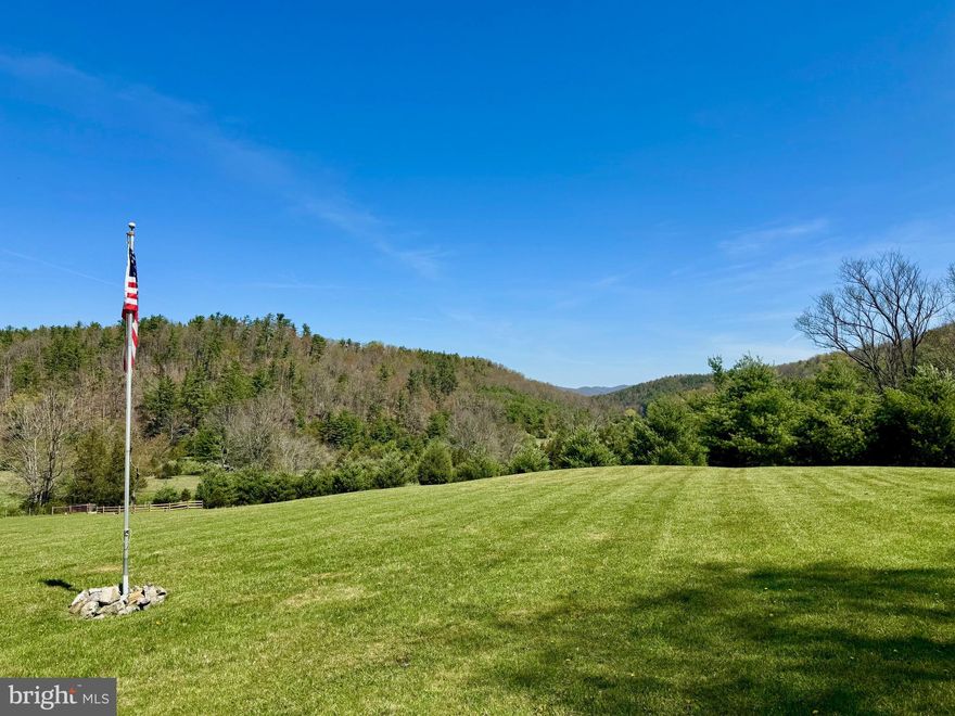 Beautiful 10+acre lot with stunning views. Includes a recently installed 2 BR conventional septic system (per county, this can be expanded), 200 amp service installed, 2002 camper and lawn mower. Spring water is hauled in holding tank. Well permit is on file and is currently valid.