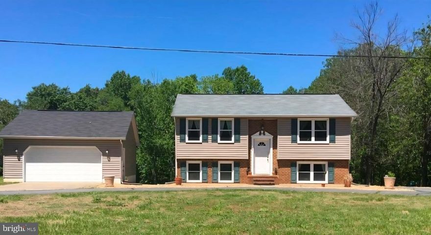 **PICTURES coming 5/17**Welcome to 16085 Ridge Road in King George—an ideal opportunity for first-time homebuyers and military or government employees looking for a move-in ready home just minutes from Dahlgren. Enjoy the convenience of a quick commute while coming home to a more private, peaceful setting.

This home offers confidence and value with major updates already completed, including a new HVAC system (2023), water heater (2023), and septic system distribution box replacement (2017). Fresh paint throughout (2020/2026) gives the home a clean, modern feel, while the remodeled first-floor bathroom (2020) adds both style and functionality.

The lower level provides flexible living space—perfect for a home office, guest area, or roommate setup—with new carpet in the bedrooms (2025) and updated French doors (2025) that bring in natural light and easy outdoor access. Step outside to the refinished deck (2026), ideal for relaxing after a long day or entertaining friends.

A standout feature is the oversized 2-car detached garage—perfect for vehicles, storage, a workshop, or hobby space.

Whether you're purchasing your first home or relocating closer to Dahlgren, this property offers the perfect blend of affordability, updates, and location—making it a smart and comfortable place to call home
