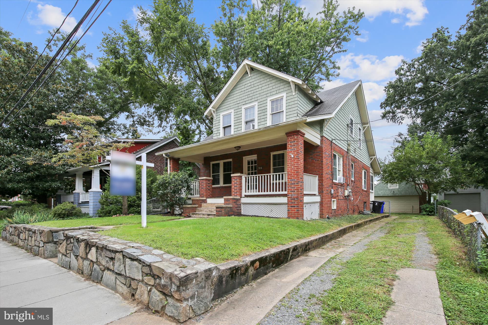 Delightful 5BR/3BA Home Just Blocks from Clarendon Metro! Location, location, location! This spacious home is just a short walk to the Clarendon Metro, Trader Joe’s, Whole Foods, Starbucks, and some of the best shopping and dining Arlington has to offer. Minutes to D.C., Reagan National Airport, and major commuter routes. Step inside from the inviting front porch to a large living room with a cozy wood-burning fireplace. The main level features a bedroom and full bath, a separate dining room, and a bright kitchen. A large covered rear porch extends your living space outdoors—ideal for relaxing or entertaining. Upstairs you’ll find three generously sized bedrooms and a full bath. The finished lower level includes a separate bedroom, full bath, and a small second kitchen. The detached garage is for landlord use only, but there is plenty of parking on the long driveway. Available for move in August 13, Must see!