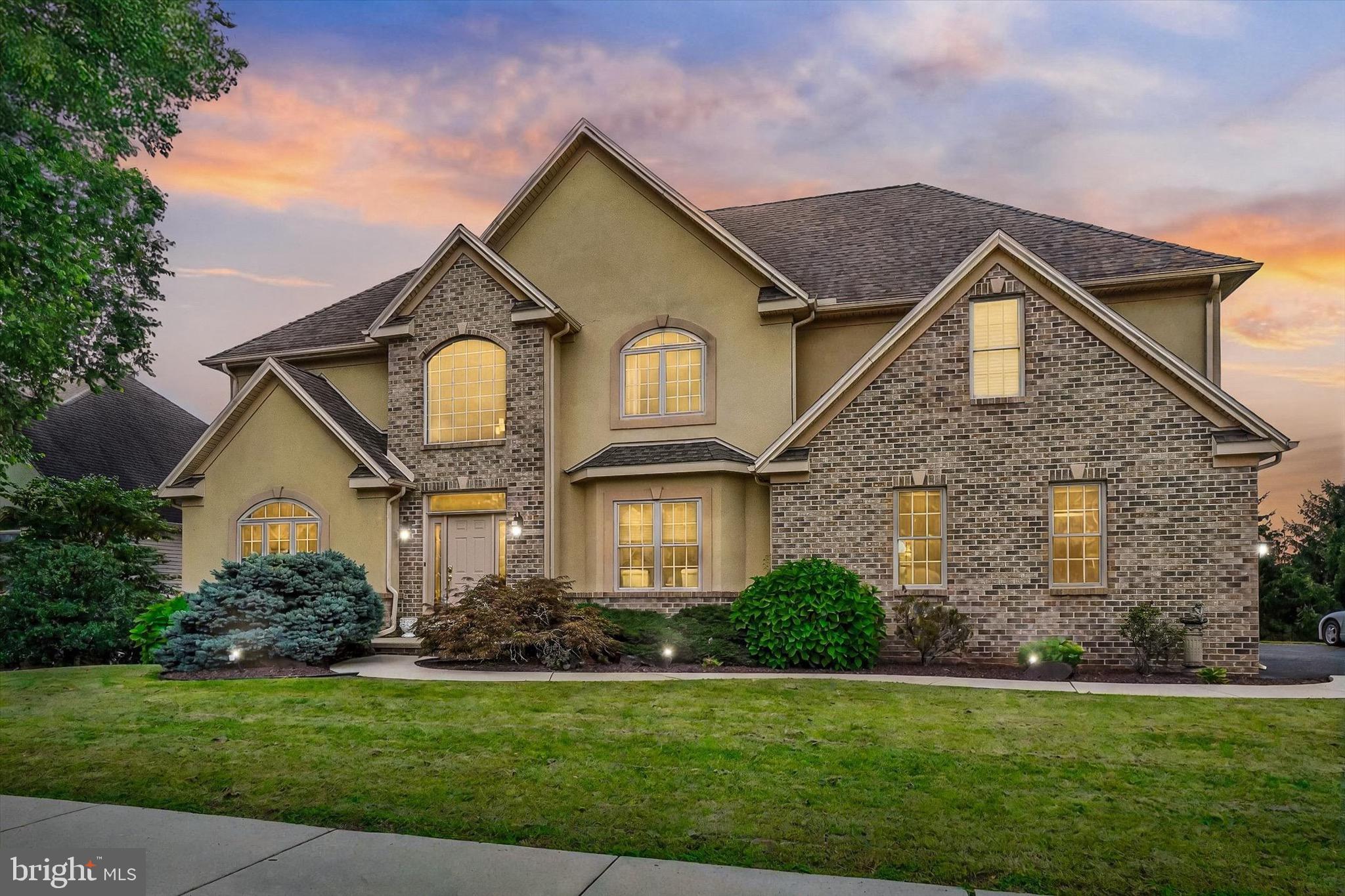 Welcome to this stunning one-owner showstopper located in the highly desired Little Creek Farm neighborhood, part of the West York Area School District. This vibrant community is known for its scenic 3-mile walking trail, lush open green space, and breathtaking views where herds of deer are often spotted throughout the seasons. Conveniently situated just minutes from UPMC Hospital with easy access to I-83 and Route 30, this location truly offers the best of both worlds—peaceful living and prime accessibility.
This 4-bedroom, 3.5-bath colonial-style home was the model home for the second phase of Little Creek Farm and showcases every option the builder offered. Boasting over 5,700 square feet (including attic space), this home is as spacious as it is stunning—and with all the storage options, you’ll never run out of room!
From the moment you step inside the two-story foyer, you’ll be captivated by the elegant staircase and beautiful crown molding. To your right is a formal dining room, and to the left, a versatile office currently being used as a sitting room.
Continue through to the open-concept kitchen and breakfast nook, which features granite countertops, stainless steel appliances, and plenty of prep and storage space. This area flows seamlessly into a breathtaking two-story family room featuring a coffered ceiling, floor-to-ceiling windows, and a cozy gas fireplace—the perfect space for gatherings. Off the family room, you’ll find a convenient half bath, and from the kitchen, direct access to your oversized three-car garage.
Upstairs, you’ll discover three spacious bedrooms that share a full bath, plus a luxurious primary suite featuring a second gas fireplace, walk-in closet, and spa-like ensuite bathroom complete with double sinks, a soaking tub, and a stand-up shower. For added convenience, the laundry room is also located on the upper level. You’ll also appreciate the unfinished attic space, perfect for easy-access storage with room to stand and organize.
The walkout lower level is partially finished with drywall and includes a full bath already in place, making it ideal for creating additional living space, a home gym, or a media room—ready for your finishing touches.
This property backs directly onto open green space—with no other homes behind it—offering serene views and exceptional privacy. With every premium detail and upgrade the builder offered, this home is truly a must-see. Schedule your private showing today before it’s gone!