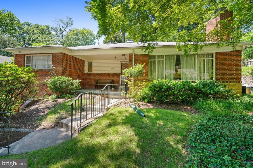 Welcome to 8008 Park Crest Drive, an enchanting Mid Century home in the sought-after Sligo Park Hills neighborhood, adjacent to Sligo Creek and its trails and bike paths.  The quiet, verdant street, the house, and even the gardens -- front, side, and rear -- all provide a sense of refuge from the day-to-day, go-go-go of the Washington DC area.

Inside, skylights bathe the kitchen and the first of two main level bathrooms with sunshine. The kitchen looks out to a peaceful rear garden featuring mature azaleas, peonies and roses. The spacious living room has floor-to-ceiling windows overlooking the park, a wood burning fireplace, original hardwood floors, and a museum-worthy mantlepiece that transports one back to a simpler time.  French doors lead from the dining room to the rear patio, flanked by a stacked stone retaining wall, with plenty of room for your grill and outdoor entertaining. 

Enjoy single-floor living with the convenience of three main-level bedrooms, including a primary with an ensuite bath. Both bathrooms include the charm of original 1949 ceramic tiling.  

The lower level has high ceilings and plenty of space for future customization and configuration, along with easy access to the attached garage and a separate entrance with steps out to the the rear garden. The laundry room has a rough-in should you wish to add an additional bathroom.

Please note: this home is being sold strictly AS-IS but has been well maintained.