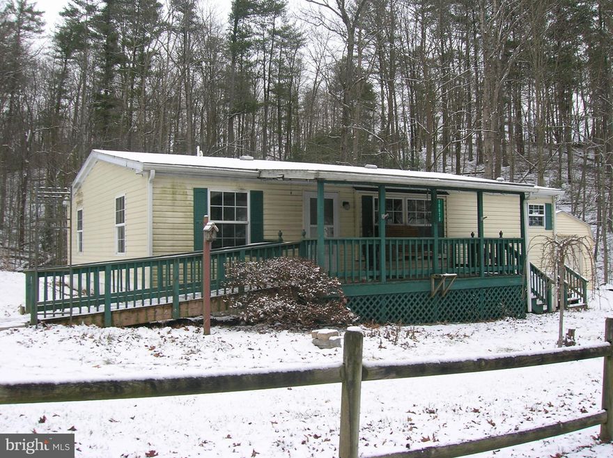 Country setting for 3 br. 2 bath doublewide mobile built in 2000.  Eat in kit. & all applicances convey.  Small laundry rm. off kit. with washer & dryer. Primary bath has double closets & bath with tub & walk in shower.
Hall bath is a shower/tub combo.  1 car detached garage & 2 sheds will convey.  Furnaced recently serviced.
propane tanks are leased.  Front & side covered porches.
This is an estate and being sold "as is" including all the appliances.