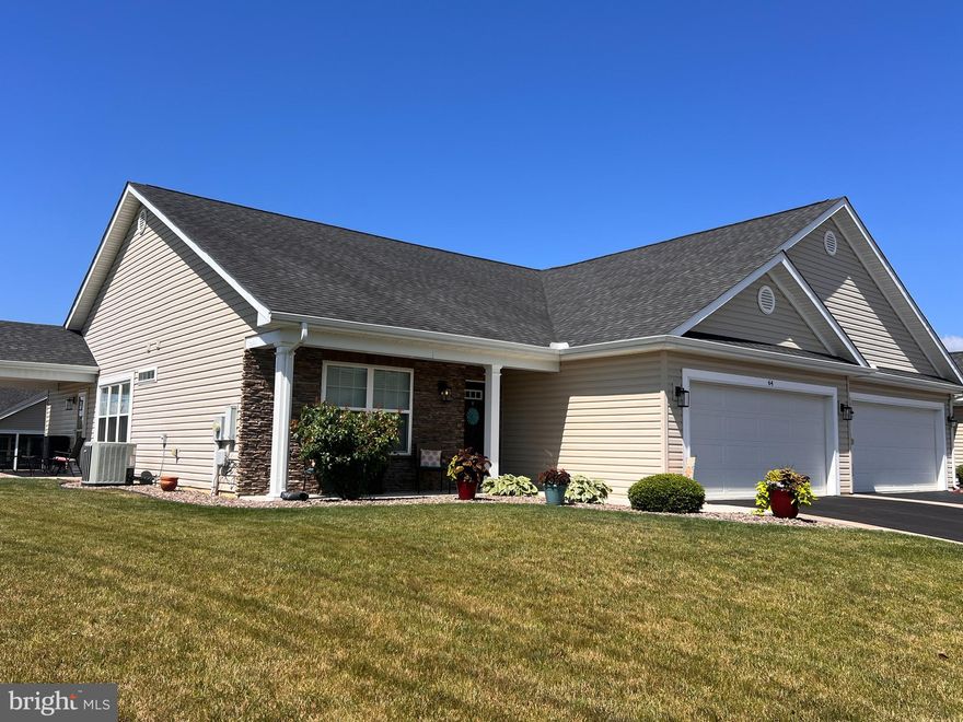 *New Windows,  Upgraded Kitchen, Hardwood floors, New lighting fixtures,  Hardscaping and Landscaping in last year! Everything is done. 

Superbly designed and immaculate 2 bdrm 2 bath Villa on a peaceful street in the lovely, well cared for Spring  Mills neighborhood of villas and single family homes.   A serene  oasis of  low maintenance, one level living &  age-in-place lifestyles with sidewalks throughout the community .

The front driveway to the attached two car garage is attractively bordered by custom laid stone and paver bricks leading up to the graceful,  artistically landscaped entrance where you’ll enjoy a wide covered front sitting porch from which to view the sunrise w/ your morning beverage.  A handsome custom crafted stone faced exterior surrounds the front porch and doorway opening into the villa’s foyer with its ample coat closet and gorgeous cherry wood  flooring. On the left off the foyer are  a bedroom w/double closet and a full separate bath w marble vanity and rich wood cabinetry.   Ceiling fans thru out add to the comfort of the home’s ambience and air quality.

Next you’ll love the open concept kitchen , formal dining area and great room w/ recessed lighting and tall wide windows all around incl custom fitted contemporary shades.  The  kitchen is  designed w granite counters and backsplashes, double stainless sink, a separate pantry and an island with space for casual eating. The island has a granite top and soft close cabinetry beneath  as are all the drawers and abundant storage cabinets. 

Artisanal lighting is a delightful detail in the kitchen and dining areas.  A door from the great room leads  to the spacious  covered side patio where sunset viewing is superb.  

To the right of the foyer is the hall to the large primary bedroom with its generous walk-in customized closet,  an en suite bath, featuring a double sink marble vanity and rich wood cabinetry on gorgeous flex step vinyl flooring.  The primary bedroom features  plenty of space for desk and lounging areas and overlooks the back of the property.  A separate laundry area is conveniently located in the hall.

The double car garage with automatic opening offers extra room in the back for storage on built in shelves & work bench space.  A large capacity heat pump handles well the home’s needs.

Welcome home to relaxed low maintenance living all on one level in a well designed, immaculate, contemporary villa in this lovely, serene Spring Mills neighborhood.