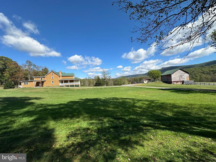 THE UNICORN....STUNNING 96 ACRE HOMESTEAD ELEVATED AT 1900 FT IN THE TROUT RUN VALLEY WITH JAW DROPPING VIEWS IN EVERY DIRECTION. UNRESTRICTED AND 100% USABLE LAND....BOUNDED ON ONE SIDE BY 1400+ FT OF FRONTAGE ON "TROUT RUN" AND BOUNDED ON ANOTHER SIDE BY 1693 FT OF FRONTAGE ON THE GEORGE WASHINGTON NATIONAL FOREST. 15 ACRES OF OPEN LAND, 8 OF WHICH ARE FENCED FOR LIVESTOCK WITH A 1/2 ACRE STOCKED POND.  MASSIVE 48X30 2 STORY BANK BARN WITH STALLS TO KEEP YOUR ANIMALS OUT OF THE WEATHER. SIMPLY PUT, THE LAND IS SPECTACULAR AND CHECKS EVERY BOX; WOODS, VIEWS, FIELD & STREAM. BORDER WITH NATIONAL FOREST PROVIDES ENDLESS OPPORTUNITIES FOR THE HUNTER & HIKER. THE HOUSE, CIRCA 1800 FOR THE ORIGINAL LOG STRUCTURE WHICH IS THE HEART OF THIS HOME, THE NEXT ADDITION IN 1923 AND IN 2006 THE CURRENT OWNERS DID THE FINAL ADDITION AND COMPLETE REHAB WITH LOG SIDING AND STANDING SEAM METAL ROOF. COMFORTABLE AND SPACIOUS, OVER 2400 SQ FT OF FINISHED LIVING SPACE. RECENT UPGRADES INCLUDE A WHOLE HOUSE GENERATOR IN 2022 AND NEW FURNACE IN 2024. THE HOME HAS BEEN WELL CARED FOR AND IS IN EXCELLENT CONDITION, SUITABLE FOR YOUR WEEKEND RETREAT OR FULL TIME HOME.  THE VIEWS FROM THE FRONT PORCH WILL BLOW YOU AWAY! GAZE UPON "BIG SCHLOSS" AND OTHER PEAKS IN THE NATIONAL FOREST, BUY WITH CONFIDENCE KNOWING THAT YOUR VIEWSHED WILL ALWAYS BE PROTECTED AS EVERY MOUNTAIN YOU SEE IS WITHIN THE FOREST. THE LOCATION....1 MILE FROM THE VIRGINIA LINE AND THE "WOLF GAP" RECREATION AREA.... 20 MINUTES FROM INTERSTATE 81, WOODSTOCK, VA & WARDENSVILLE, WV....111 MILES FROM THE WHITEHOUSE.....EASY 1.5-2 HOUR DRIVE FROM ANYWHERE IN NORTHERN VIRGINIA BUT FEELS LIKE YOU'RE ON THE OTHER SIDE OF THE PLANET. A TRULY SPECIAL PROPERTY, POSTCARD WORTHY PICTURES CAN BE TAKEN FROM ANY SPOT. THE PHRASE "ONCE IN A LIFETIME OPPORTUNITY" IS WAY OVER USED IN THE REAL ESTATE BUSINESS BUT APPLIES HERE. THIS PROPERTY IS THE DEFINITION OF A "UNICORN" WHAT WE THINK DOES NOT EXIST UNTIL YOU SEE IT WITH YOUR OWN EYES! PRE QUALIFICATION LETTER OR PROOF OF FUNDS REQUIRED TO SCHEDULE APPOINTMENT, NO EXCEPTIONS!