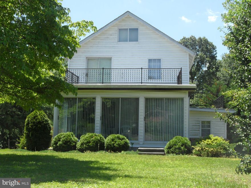 HOME IS BEING SOLD AS IS. AND IS IN NEED OF SOME UPDATING.  FOUR BEDROOM HOME IN A PRIVATE SETTING WITH 2 1/2 BATHS AND A SECOND KITCHEN AND LIVING AREA ON THE LOWER LEVEL. INCLUDES UPDATED KITCHEN WITH UPDATED WINDOWS, TWO SUN ROOMS AND A FLOORED ATTIC FOR STORAGE. HUGE PAVED DRIVEWAY THAT CAN HOLD UP TO TEN VEHICLES. CONVENIENT TO SHOPPING, I95 AND EDGEWOOD AREA OF APG.