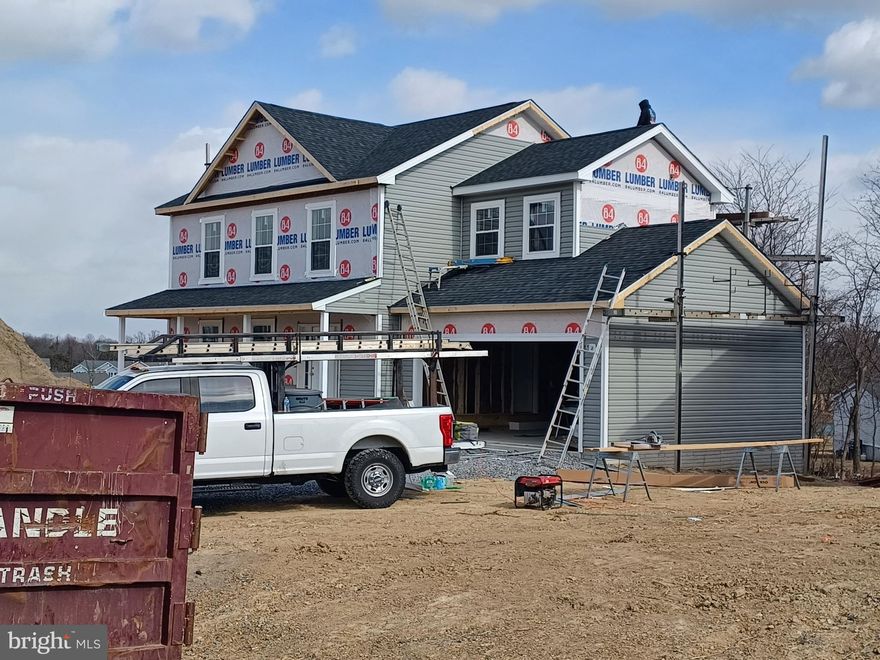 Great family home situated well established neighborhood. Great commuter location and convenient to schools & shopping. Kitchen has granite countertops with island and is open to family room. LVP flooring in  foyer, dining and Kitchen area.  Living room has carpet. 10 X 12  deck with vinyl rails and accessible from the kitchen for easy grilling or enjoying your morning coffee.   This home features 3 large bedrooms and a primary suite with tray ceilings on the upper level.   All bedrooms have standard fan/lights. Primary bath has ceramic flooring and ceramic surround in oversized shower with seat, glass doors and a walk in closet.  Laundry room on bedroom level with tiled flooring. Two car garage which is insulated, lots electrical outlets, insulated garage door and opener. Full walk out basement with finished family room and  3rd full bath.  Photos shown are of similar construction but may show some upgrades. Tons of standard features that other builders charge for as options. Depending on stage of construction, Homeowner may pick all interior finishes. Models Available for viewing. As with all new construction, WV transfer taxes are paid by Purchaser.