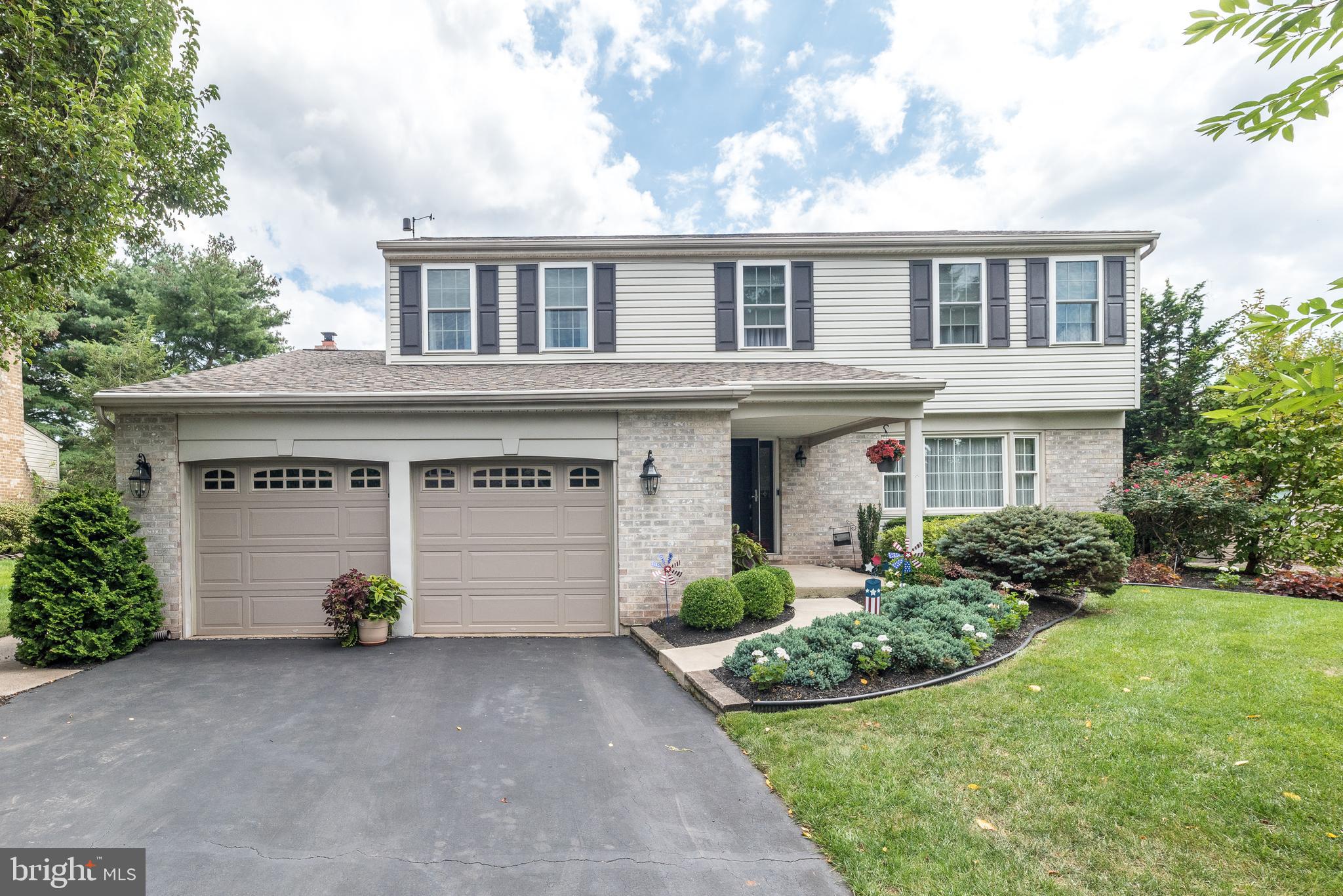 Welcome Home! This move-in ready, meticulously maintained 4-bedroom, 2.5-bath single home offers 2,433 sq ft of above grade living space and is located in the highly sought-after Gristmill Run neighborhood of Towamencin Township, within the award-winning North Penn School District.
From the moment you arrive, you’ll notice the beautifully landscaped grounds with an irrigation system for the flower beds, along with a low-maintenance exterior and no stucco to worry about. Step inside the foyer and be greeted by gleaming hardwood floors that flow into a formal living room and spacious dining room, both enhanced with crown molding. The updated eat-in kitchen is designed for today’s lifestyle, featuring a tile floor, granite countertops, stylish backsplash, stainless steel appliances with a 5-burner gas range, built-in microwave, recessed light ing, pantry, coffee/butler nook with built-in shelving, and abundant cabinet space. Just off the kitchen, the sunken family room is a warm gathering spot with a brick propane fireplace and mantel. A newer sliding door with built-in blinds opens to a large paver patio and expansive backyard, perfect for entertaining, relaxing, or hosting family gatherings. A spacious shed provides additional outdoor storage. Additional first-floor highlights include, two coat closets, half bathroom, laundry room with wash sink, storage cabinets, and tile flooring. Upstairs, retreat to the spacious primary suite, complete with a walk-in closet and a beautifully updated bath showcasing a frameless glass shower, ceramic tile, granite vanity and linen closet. The hall bath features a double vanity, tile flooring, linen closet, and a tub/shower combination. Three generously sized bedrooms and a whole-house fan complete the second floor. The entire home has vinyl tilt down windows. The unfinished basement offers endless potential for future living space, while the oversized two-car garage provides extra storage and cabinetry. This exceptional home is conveniently located near Merck, SKF USA, SEPTA Regional Rail, the PA Turnpike, major highways, parks, shopping, and dining. Don’t miss the opportunity to make this well-maintained property your dream home and schedule a showing today!