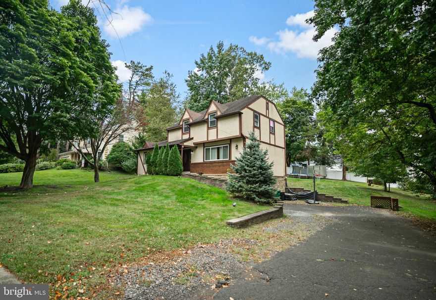 Welcome to 1435 Churchville Road, a beautifully maintained Colonial style home in Southampton offering classic charm and spacious living in the highly sought after Centennial School District. This inviting property features 4 bedrooms and 2.5 bathrooms, including a convenient first floor bedroom, perfect for guests, a home office, or multigenerational living. Step inside to find a warm and welcoming living area centered around a classic brick fireplace, ideal for cozy evenings. From here you can also access your own private deck overlooking the large backyard. The traditional floor plan flows into a bright dining area and a well-appointed kitchen, perfect for everyday living and entertaining. Upstairs, you’ll find three generously sized bedrooms, including a spacious primary suite with a private full bathroom. An additional full hall bath ensures comfort and convenience for the whole household. The home also includes a half bath on the main level, a basement offering plenty of storage or potential for finishing, and direct access to the attached garage. Don't miss the opportunity to own this timeless home in a prime Bucks County location!