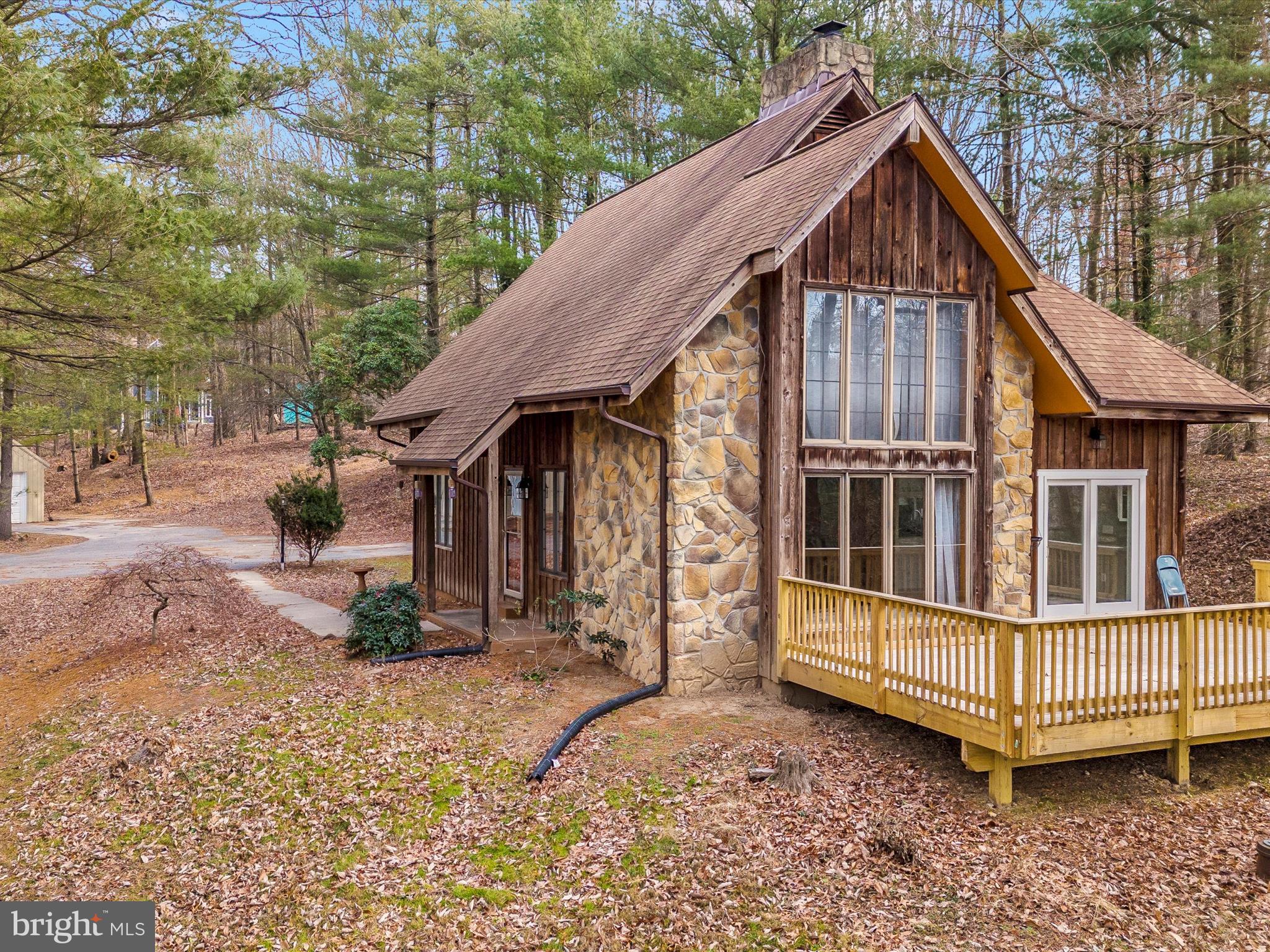 Amazing A-Frame home with new, full sized, rear deck. This house has been completely renovated on the inside with new appliances, new HVAC and 5 year old roof. This custom built home on 2+ wooded, private acres boasts LV hardwood floors, cathedral ceiling, stone interior, floor to ceiling wall, in-law suite in the basement and large floor to ceiling windows for plenty of natural light.
This home also has a 600 sqft out building/garage for a wood workers paradise. Electric runs to this outbuilding.
Don't miss out on this custom, one of a kind, chalet style home in the country.