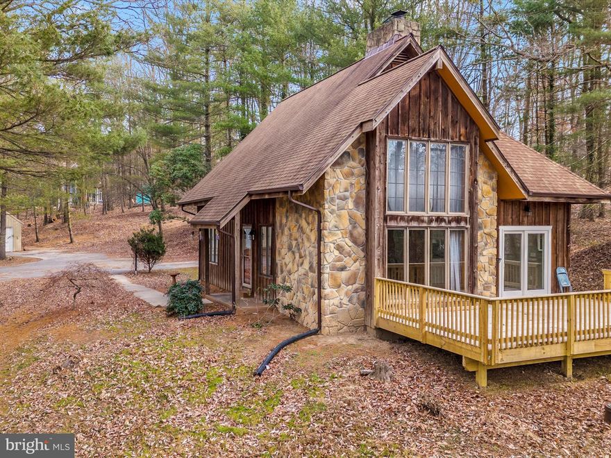 Amazing A-Frame home with new, full sized, rear deck. This house has been completely renovated on the inside with new appliances, new HVAC and 5 year old roof. This custom built home on 2+ wooded, private acres boasts LV hardwood floors, cathedral ceiling, stone interior, floor to ceiling wall, in-law suite in the basement and large floor to ceiling windows for plenty of natural light.

This home also has a 600 sqft out building/garage for a wood workers paradise. Electric runs to this outbuilding. 

Don't miss out on this custom, one of a kind, chalet style home in the country.