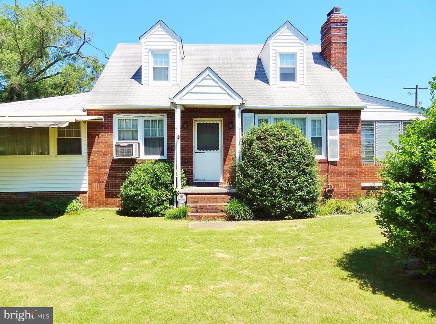 Large Brick Cape Cod home with 14'x17' Sunroom addition w/heat & a/c.  Enormous fenced corner lot with spacious shed, brick patio and barbecue pit.  Parking space for up to SIX vehicles!  Opened kitchen leads into dining room.  Full bathrooms on main and top level.  Basement with room for den/home office.  Updated energy-efficient oil baseboard heating system.  Lots of space for your family!
