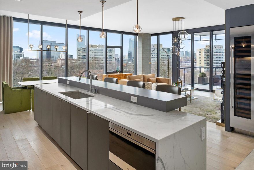 One of the first resale units being offered at 2100 Hamilton.  This unit is 100% completed,  features  high-end designer finishes and is conveniently turnkey ready. This 3-bedroom, 3.1-bath residence at 2100 Hamilton sets the standard for exquisite city living in the heart of the Art Museum Area. Featuring an open floor plan, this home affords panoramic views of the city and museums from each of its professionally designed spaces. A transitional aesthetic masterfully blends modern patterns and textures with colors inspired by natural elements. It’s timeless, with clean lines and a soft palette punctuated with bursts of color from art and furnishings. The elevator, operated via facial recognition, whisks you directly from the valet parking garage with two (2) private parking spaces into Residence 7A, avoiding shared hallways and affording a high level of privacy. Inside, floor-to-ceiling windows that draw your attention to riveting cityscapes, a abundance of natural southwest light, incredible sunsets and all of the city’s world-class museums in the distance. The open-plan main living space is designed for easy elegance with doors that slide open at the touch of a button and extend your living space to the private, heated terrace. The Joanne Hudson kitchen is smartly designed with cabinetry in two tones, bar seating, Wolf induction cooktop and a full suite of Wolf/Cove appliances, including a full-size wine refrigerator. Pantry storage is built into the kitchen while a full-size laundry room includes additional cabinetry. A gas fireplace warms the main living space, which also includes a dining area where guests can enjoy a stunning city lights backdrop during dinner. Private quarters include the main suite bedroom which is finished with a gas corner fireplace and two walk-in closets with custom, back lighted built-ins. The bedroom has access to the heated terrace. The main suite bath, with radiant heat floor, has clean lines and top-grade finishes and fixtures. There are two additional bedrooms, both with ensuite full baths. One bedroom is now used as a den and can be closed off from the main living space when privacy is needed. Each of the guest bedrooms is well positioned for privacy from the main suite.  All living spaces and bedrooms are complete with electronically controlled custom installed Hunter-Douglas shades.   For buyers accustomed to outdoor space, 2100 Hamilton has the city’s largest residential garden and event plaza, designed by renowned landscape architect Sikora Wells Appel, with water and fire features and multiple seating areas to accommodate a group or a private spot just for you. Additional building amenities include an indoor infinity pool, guest suite, boardroom, top-grade fitness center, catering kitchen and amenity lounge, town car and driver, and 24-hour concierge. 2100 Hamilton is a 27-unit condominium building designed by award-winning architect Cecil Baker. Unit 7A is also available furnished.  Approximately 8 years remaining on the Philadelphia tax-abatement. Schedule an appointment to see this best-in-class residence. This unit INCLUDES 2 parking permits, a builder value of $200,000