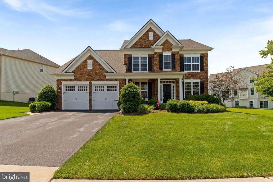 BUILT IN 2012 means low maintenance and less headache!  Gorgeous Augustine "Potomac," model with stunning full stone front and porch! 4 bedrooms and 5 baths. You will find tons of upgrades and a beautiful flowing floorplan   The back yard is all set for summer with a gorgeous stamped concrete patio and beautiful Pergola   This home is perfect in every way! Situated on a .34 acre lot with privacy from Route-1/I-95   This home boasts an attached two-car garage with entry into a spacious laundry/mudroom that has been customized with a bead-board wall treatment. When you enter through the front door you are welcomed by lovely hardwood flooring that graces the entire main level as well as the upper level hallway   Custom columns and  iron staircase   Formal living and dining rooms have crown and shadow box moldings   Work from home in the convenient main level office    Fabulous modern and spacious kitchen has it all    Enjoy 42" maple cabinets,  granite counter tops, tons of recessed lighting, stainless appliances, double ovens,  gas cooking, pendant lighting over the spacious island and more! Relax in the family room with gas fireplace or enjoy breakfast or a good book in the adjoining morning/sunroom   Both are  off the kitchen   Upstairs are 4  bedrooms and 3 full baths   Owners  suite has a cozy sitting area, walk-in closet space and a luxury en-suite bath that is to-die-for! Entertain your guests in the finished walkout basement featuring a great recreation room,  large bonus den with another full bath and extra storage space   Relaxing outdoors will be a breeze on the incredible outdoor patio with access from both the basement and main-level morning room.  Fantastic location just minutes away from shopping at Towne Center at Aquia, Stafford Marketplace, and Brafferton Center   Welcome, new neighbor, to Hills of Aquia!