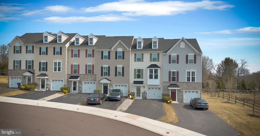 Welcome to the meticulously maintained 3-bedroom, 2.5-bathroom townhome in the Main Street Crossing community. Built in 2017, this 2,260-square-foot home offers plenty of luxurious features. The main floor features beautiful hardwood floors, a gourmet kitchen with granite counter tops, a custom tile backsplash, stainless steel appliances, and an over-sized center island. The kitchen seamlessly connects to the dining and great room, perfect for both casual living and entertaining. The sliding doors open to a durable Trex deck with privacy wall and verdant outdoor space. The home boasts peaceful views of green space and sunrises in the back, with stunning sunsets from the front.  On the top floor you will find the spacious primary bedroom, which includes a beautiful tray ceiling, a large walk-in closet, and en-suite bathroom. There are two additional bedrooms, full hall bathroom, and convenient laundry rounding out the top floor. The first floor is fully finished space that provides room for storage, an office, and additional entertainment areas. It includes upgraded LVP flooring, trim, recessed lighting, and crown molding. This walk-out finished space has a sliding door leading to a new exterior patio, and additional space for recreation or relaxation. The first floor also features a half bath, a coat closet, and an additional extra large storage closet. The garage has interior access and provides ample storage space.

Recent upgrades include motorized SunSetter awning with wind sensor, brand new sliding glass doors for both the patio and deck, and custom whole-house painting. Don’t miss the custom built garage shelving which allows for parking while adding storage.

Located just minutes from shopping, dining, Waterworks Park, the Schuylkill River Trail, and Ursinus College, this home is situated in the highly regarded Perkiomen School District, offering great community amenities and outdoor recreational opportunities.