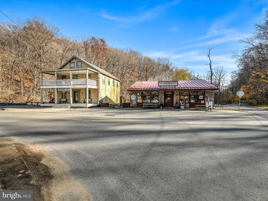 Discover the perfect blend of history, charm, and opportunity with this extraordinary property in Landenberg, PA, amongst the rolling hills of Chester County. This stunning 1872 residence has been meticulously renovated and is situated next to the thriving Landenberg Store, a beloved small-town general store. Live in a home that seamlessly combines classic old-world charm with contemporary conveniences, and operate a successful business right next door! With approximately 3,200 square feet of living space and an additional 2,200 square feet of commercial space, this property offers plenty of living space for all to spread out,  and a commercial space that is well-known and cherished amongst the locals. The residence is a masterpiece of modern updates and timeless appeal. On the main floor, a beautifully designed kitchen features new stainless steel appliances, a large island with a quartz waterfall edge and barstool seating, white cabinets with glass fronts, connected to a spacious dining area with a vaulted ceiling with charming beams, surrounded by windows and sliding doors that offer panoramic views of White Clay Creek. The cozy informal family room flows into a more formal living room with a half bath, while a charming library near the entrance currently serves as a second office- wait until you see the beautiful built-in shelving! Off of the family room, accessible via a private staircase, you will find a spacious bedroom with a brand new ensuite bath. This room offers built-in custom bunk beds a convenient sink. The main staircase leads to two additional bedrooms, each with its own bath, and an upper-level deck spanning the width of the home. A private one-bedroom in-law suite with its own deck and entrance at the back of the second floor is perfect for in-laws or guests. On the third floor, the primary suite is a sanctuary, complete with a luxurious new ensuite bathroom with new tub and shower with glass shower enclosure, built-in shelving, and a blank-canvas walk-in closet space, as well as a private balcony overlooking the serene landscape. Throughout the entire residence you will find designer lighting and fixture selections, high ceilings + baseboards and intricate crown molding detail. The original hardwood flooring maintains the 1870's appeal while the other selections compliment the era seamlessly. The Landenberg Store is a well-established community hub known for its warm and inviting atmosphere and known local favorite, Creekside Coffee. The store offers breakfast, lunch, and dinner, with a menu that features specialty sandwiches, fresh baked goods, and signature items like penny candy and local ice cream. Popular with locals and visitors, the store also showcases products from local artists, hosts a free book and puzzle exchange, and serves as a resource for community referrals and friendly advice. With a loyal following of over 3,000 people on Facebook, it continues to thrive as a neighborhood favorite. Located at 100 Landenberg Road, this unique property is both a dream home and a business opportunity. Its classification as a commercial property, it presents an unparalleled chance to own a piece of Landenberg’s rich history. If you’re looking to run a successful business and enjoy life in a historic and beautifully renovated home, this property offers an incredible lifestyle in a picturesque setting, well known for hiking and biking at the nearby Landenberg Junction Trail, swimming in the creek, as well as a backdrop for a photography session- a truly beautiful nature scene surrounds you!  Don’t miss out on this one-of-a-kind opportunity!