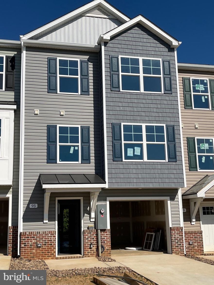 Brand New Townhomes in The Communities of Burwell! The difference is in the details — and they’re all included! 
Discover the perfect blend of comfort, style, and convenience in these beautiful new townhomes offering 1,875 sq. ft. of thoughtfully designed living space. The open main level welcomes you with luxury vinyl plank flooring, a spacious family room extension, and a stunning kitchen featuring granite countertops, stainless steel appliances, and a large island with bar seating—ideal for entertaining or everyday living. Upstairs, the impressive primary suite showcases vaulted ceilings, a generous walk-in closet, and a spa-inspired bath with a tile shower and glass door. Two additional upstairs bedrooms provide plenty of space for family, guests, or a home office. The finished lower level includes a fourth bedroom and full bath, offering flexible options for your lifestyle. A brick-accented exterior, 1-car garage with opener, and concrete driveway complete the package—enhanced by ample overflow parking just steps away for added convenience. Ideally situated just minutes from I-81, shopping, grocery stores, and popular restaurants, The Communities of Burwell offers both modern living and everyday ease. Photos are of similar construction. A similar home is available to view in our Heritage Hills community.