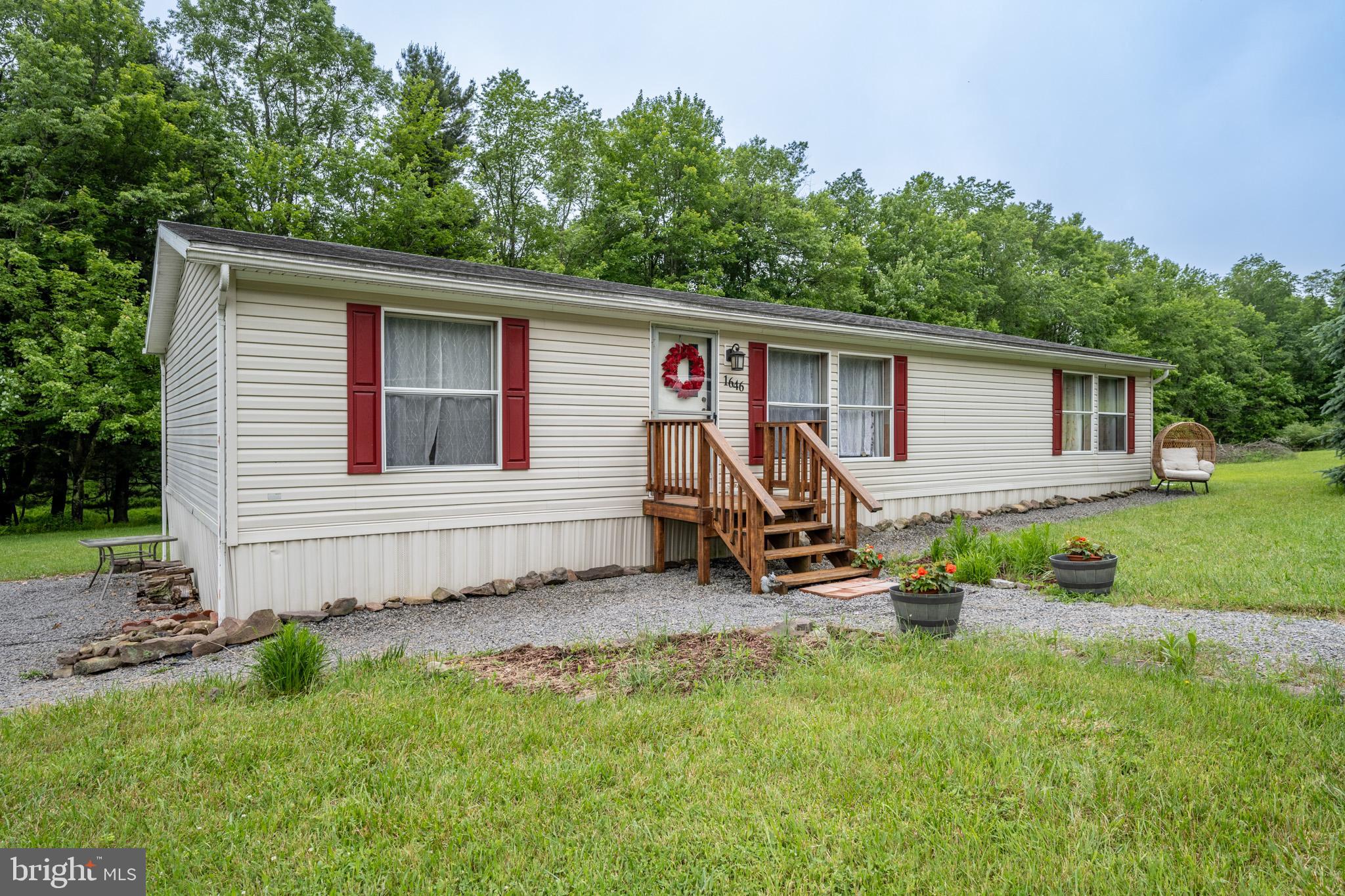 Tucked deep in the trees on a quiet, lake access 2-acre lot, this hidden gem adjoins Deep Creek Lake along North Glade Run—private, peaceful, and only 10 minutes from marinas, restaurants, and state parks! Single-level living with 3 beds, 2 full baths, and just the right amount of updates, including a freshened bathroom and open layout that flows easy. Well-kept kitchen with solid appliances. No frills, no fluff—just a smart, affordable way to get close to the lake without the noise. Shed out back for gear. Perfect for anyone craving space, woods, and a little water… Call today for details!