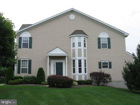 Beautiful light filled end-unit which backs to open space.

Hardwood floors throughout the main level.  Spacious formal living and dining rooms.  Two-story family room with marble wood burning fireplace.  Spacious eat-in kitchen features 42" maple cabinets, Corian counters, breakfast bar and ceramic tile floor.  The second level features the master suite with cathedral ceilings, two walk-in closets and a luxurious master bath complete with a jacuzzi tub and dual vanities. Two additional bedrooms and a hall bath complete the upper level. The full finished basement with daylight windows is bright and open. Plenty of room for storage.

Easy commute to Princeton, Doylestown, Philly, and trains to NYC.