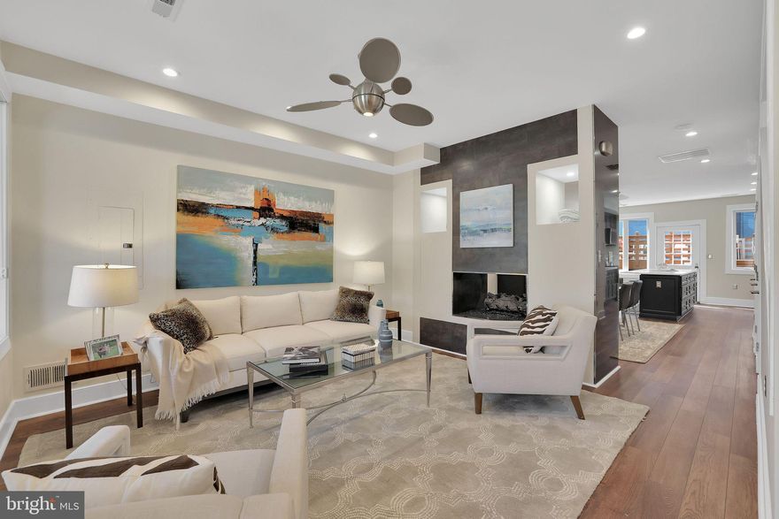 IT'S 3604 THE WIN -- WITH INCREDIBLE PRICE IMPROVEMENT! It's the stunning finishes, eye-popping upgrades, and quality renovation. Combine all these vaunted variables and put them in one of the District’s most inviting neighborhoods, and 3604 11th St. NW hits ALL the high notes! Step up from the charming, one-way residential street and through the quaint front garden into a true showplace. Be wowed immediately by the main floor, completely reimagined in 2020. The Lifeproof LVP floors with radiant heat are sumptuous, but the gas fire feature adds an even cooler degree of cozy. The overflowing kitchen and dining area pop with Carrara Marmi quartz counters and a gorgeous, custom-addition butcher-block bar. Just beyond, the private back deck is perfect for outdoor entertaining or a low-key dinner al fresco. The second floor, with separate laundry room, features two ensuite bedrooms. The sweetest fruit, however, may be at the highest branch:  an entire third-floor primary suite in a league of its own. The sleeping area includes a balcony and Elfa walk-in closet. At the front of this suite is a loft that could serve any number of needs. The primary bathroom, however, completely redone in 2022, is incomparable. The Madeli floating vanity is lovely, but that 72-inch Madeli Slique Sanctuary mirror is mesmerizing. You’ll have trouble choosing between a long soak in the deep spa tub or efficient luxuriance in the Kohler Thermostatic shower. And the Toto Neorest toilet will likely tickle your fancy in ways you can't yet even imagine. Rounding out the tour of this heavenly home, with its soaring ceilings, the sub-level offers another full bath, second washer and dryer, storage, and an open footprint to easily create a fourth ensuite bedroom. Already plumbed for a possible kitchenette, it's nearly self-contained. Below the large deck, you'll find garage parking with automatic door and a built-in EV charger. This winning property offers so much. Add the incredible location, and you've got everything! Easy "Walker's Paradise" access is a given with a 92/100 Walk Score. Of course, you're right between two Metro stations ready to whisk you anywhere in the D.C. area. But it's the vibrant venues starting just a block south that should get your mouth watering. Consider Queen's English, a James Beard Foundation Award 2025 Finalist! Or The Coupe, El Chucho, Buddy's, and so many more. Whatever your appetite, your new neighbors will have you absolutely covered. Any way you cut it, it's 3604 the win.