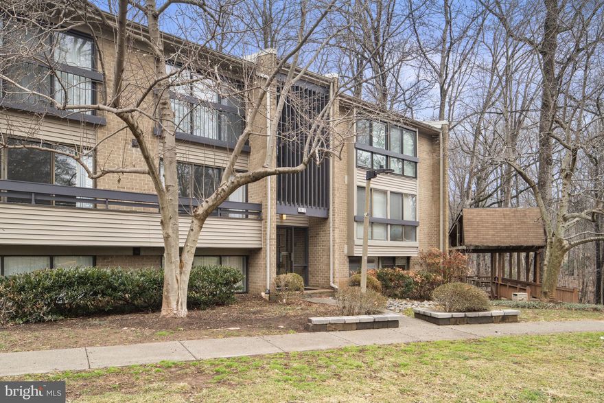 Welcome to this stylish mid century condo overlooking the Reston National Golf Course in the sought after Woodwinds community of South Reston. Freshly updated with new paint and carpet, this home is ready for its next owner to enjoy from day one. Expansive floor to ceiling windows fill the space with natural light and frame peaceful green views creating an inviting atmosphere throughout. Featuring over 1,100 sq ft of versatile, thoughtfully designed living space, this condo offers comfort and function alongside two private balconies, perfect for morning coffee or a relaxing dinner overlooking the golf course. Additional conveniences include a single coved parking space providing protection from the elements year round. 

Conveniently located in South Reston, allowing for easy access to shops, restaurants, the Dulles Toll Rd, and Reston's extensive network of trails.  Competitively priced, this is your chance to own a mid-century gem in one of South Reston's most desirable communities.