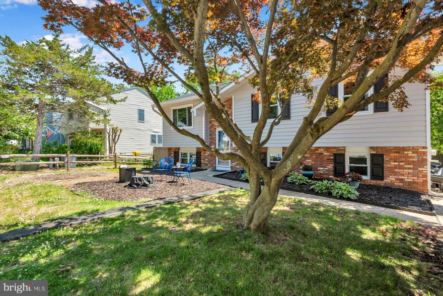 Welcome to this beautifully maintained 4-bedroom, 2.5-bath split foyer home in the sought-after Hidden Ridge community! The light-filled main level features hardwood flooring throughout and provides access to a large Trex deck overlooking the spacious, fully fenced backyard — perfect for relaxing or entertaining.
The kitchen is equipped with stainless-steel appliances, a tile backsplash, and plenty of cabinet space. The lower level offers luxury vinyl flooring throughout, a cozy family room with fireplace, and a spacious 4th bedroom featuring charming wainscoting. Major updates provide peace of mind, including a new roof, siding, doors, and HVAC system all completed in 2019. Additional improvements include the Trex deck (2021), windows replaced between 2021–2023, a renovated bathroom (2021), and a new dryer (2025).
Enjoy the outdoors with walking and biking trails just steps away, plus a large community park directly behind the property that can never be developed — offering lasting privacy and open views. Spend evenings grabbing a dinner at Donnelly's Dockside or watching the sunset over the Magothy River at The Point Crab House & Grill.  This home combines comfort, space, and an unbeatable location. Don’t miss this excellent opportunity to own a well-cared-for home in a highly desirable community! This community is located close to the recently installed Broadneck Peninnsula Trail..as well as in the Broadneck School district and within close proximity to Bay Hills Shopping Center. The home is also just minutes from Bay Hills Golf Course, including a recently renovated clubhouse with indoor and outdoor dining. With convenient access to Route 50, I-97, the Chesapeake Bay Bridge, Ft. Meade, Baltimore, Washington, D.C., and Annapolis, this home offers both comfort and an fabulous location. An excellent opportunity to own a well-maintained home in a sought-after community!!
