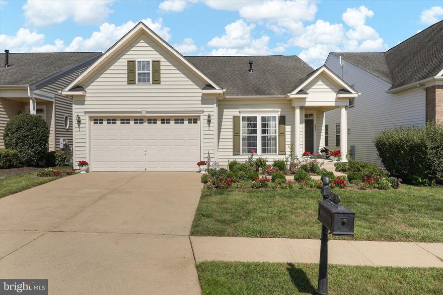 Welcome to this exceptional home in a vibrant 55+ community, where comfort meets convenience. This thoughtfully designed 3 level  three-bedroom, four-bathroom residence offers over 3,800 square feet of living space that seamlessly blends relaxation with functionality.
Step onto the expanded covered front porch and discover an open floor plan filled with natural light. Gleaming hardwood floors flow throughout, complemented by a cozy gas fireplace in family room that creates the perfect ambiance for quiet evenings. The separate living and dining areas provide ideal spaces for both intimate gatherings and entertaining guests.
The heart of the home features a spacious kitchen with upgraded countertops, abundant cabinet space, and modern stainless steel appliances. A convenient pantry ensures storage is never an issue. The bright sun room offers a tranquil retreat, while the main level laundry adds everyday convenience.
The primary bedroom sanctuary boasts elegant tray ceilings, chair rail details, and a luxury bathroom complete with soaking tub and walk-in shower. A second bedroom and full bathroom complete the main level. Upstairs, a versatile loft  w/third bedroom and its own full bathroom.
Outside, beautiful landscaping frames a generous Trex deck – ideal for morning coffee or evening barbecues. The fully finished recreation room provides endless possibilities, featuring interior access stairs, a full bathroom, and expansive storage areas.
Recent updates include a new heating and cooling system in 2025 and water heater in 2024. With nearby amenities including Publix Super Market, Lee's Parke Club House, and convenient train access, this home offers the perfect blend of peaceful community living and modern convenience.