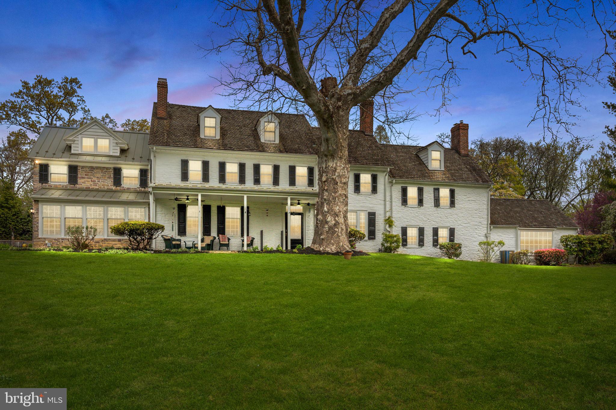 Nestled in the heart of scenic grounds, this stunning Colonial home built in the 1800s, is not just a house - it's a timeless treasure waiting for you! This Quaker estate, known as "Vernon", was signed with a land grant from William Penn in 1736 and originally built for the Jenkins family, founders of Jenkintown and has been toured often by the Philadelphia Horticultural Society. It is also believed to be one of the sites for the Underground railroad. This spacious 6 Bedroom home has plenty of space for guests or even a home office. Cozy up to one of the many fireplaces throughout this home, which offers warmth and character to your winter evenings. Cook up a culinary masterpiece in a beautifully modernized eat-in Kitchen that blends historic charm with contemporary convenience. This Kitchen features lots of cabinetry, an abundance of counter space, a fireplace and stainless steel appliances. The Kitchen opens to a Family Room with lots of windows and French doors leading to the outside. To the right of the Foyer is an Office with custom built-ins and a fireplace. The Office opens to a Billiard Room with door access to the outside and a second set of stairs leading to a Bedroom on the second level. This Bedroom features stairs leading to a Bonus Room above. Step down from the Billiard Room to the Living Room with a vaulted ceiling, custom built-ins, two doors that open to a hidden wet bar and flagstone steps that lead to door access to the backyard. The backyard offers a flagstone patio and a smaller paver patio. Experience transquility with ample space between you and your neighbors, making this perfect for entertaining, gardening or simply enjoying peaceful moments in nature. Take the main staircase in the Foyer to the second level. This level offers a Primary Bedroom Suite with a Laundry Room, walk-in closet with custom built-ins and an updated full bathroom with a large stall shower, make-up area and water closet. There is an oversized hall Bath with a stall shower. In addition, there are three nice sized Bedrooms and two of the Bedrooms share a Jack and Jill Bathroom. Completing this level is another staircase leading to a third level. This level features a sitting area, two additional Bedrooms and a full Bathroom with tub and a Bonus Room with a cedar closet. Completing this home is an over-sized two car detached garage with steps to a second level, great for storage. This Colonial gem seamlessly combines rich history with modern living. Whether you're hosting gatherings in the sprawling yard or enjoying a quiet evening by the fire, this home truly has it all. Make an appointment today!