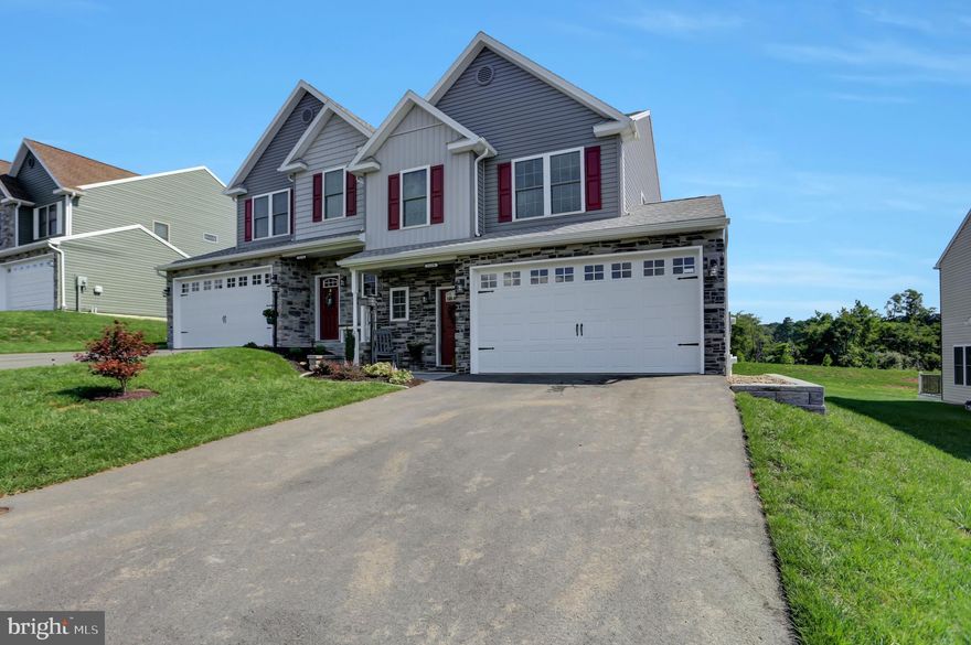 Better than new! This one year old home has been meticulously maintained and tastefully upgraded even further during it's ownership.  This does not feel like a townhome!  There are three very spacious bedrooms. Two full bathrooms and a half bath on the main level. The primary bedroom has tray ceilings, a full en suite bathroom and an impressive walk-in closet with extra sitting room space by a beautiful window.  A large two car garage and walkout deck with views of the countryside.  High end stainless steel kitchen appliances (refrigerator, stove, dishwasher, built-in microwave, garbage disposer), front loading LG washer and dryer and custom blinds are all included! Gorgeous and easy to maintain landscaping with stone edging, newly laid stone walkway to the backyard and a freshly reseeded lawn that will give you plush and sustainable landscaping for years to come.  This is a must-see property if you want new construction with the upgrades without the new construction price!