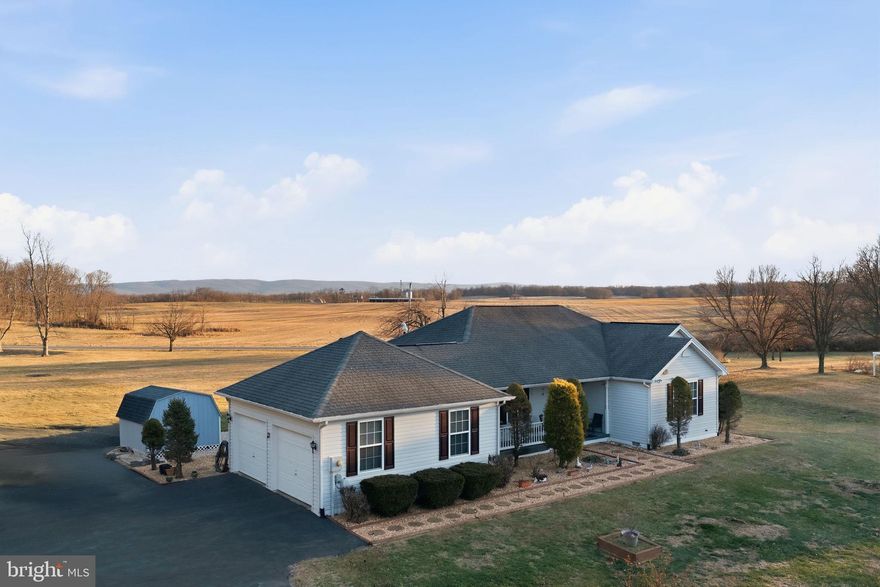 Located in the peaceful Pheasant Hill community of Summit Point, this home offers the privacy of the countryside while maintaining convenient access to local amenities and a quick easy commute into Northern Virginia.  Situated on nearly 2.5 acres of manicured grounds, the backdrop for this home is of the Blue Ridge mountains creating a stunning atmosphere.  The 1,700 sq. ft. floor plan is designed for effortless flow and comfort, featuring four spacious bedrooms and two full baths bathed in natural light.  For those seeking even more room, the spacious walk-up unfinished basement provides a blank canvas perfect for a home gym, workshop, or future recreation room. The oversized two-car attached garage offers ample room for vehicles and additional storage.  Step outside to a backyard built for relaxation and entertainment. Whether you are hosting summer gatherings on the custom deck or taking a dip in the sparkling above-ground pool. This property also features a high-quality storage shed fully equipped with electrical service, ideal for a hobbyist or dedicated garden center.  Call today for a private tour!