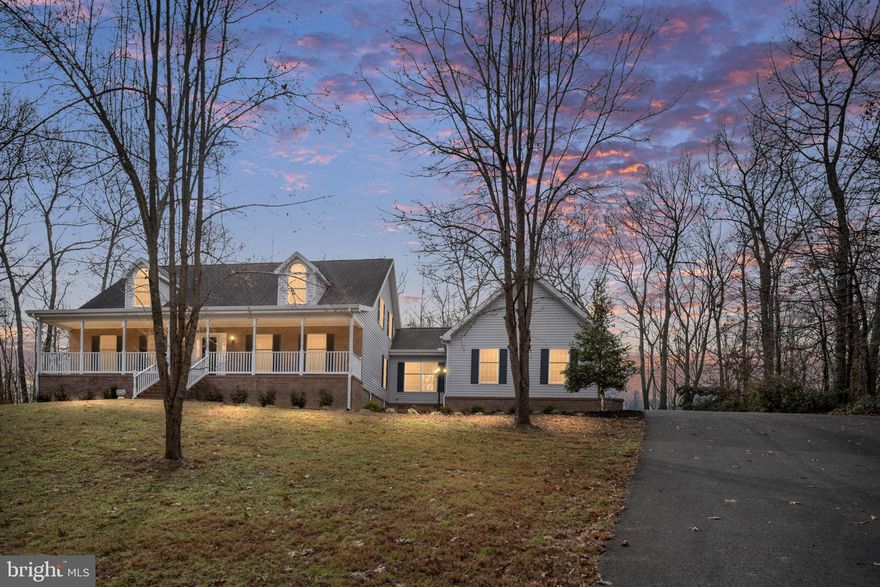 Fantastic Value for this better than New home! This one has it all! MUST SEE to fully appreciate the details.   Welcome to Howard Trail — a fully reimagined luxury residence offering nearly 5,000 finished square feet on 1.62 private acres, ideally located close to top schools, shopping, and conveniences. Completely renovated from top to bottom, this better-than-new home delivers exceptional quality, sophisticated design, and thoughtful upgrades throughout. Designed to impress while remaining highly functional, the home features 5 bedrooms and 4.5 baths, including a luxurious primary suite with hardwood flooring, a custom walk-in closet, spa-inspired bath with soaking tub, oversized tiled shower with glass enclosure, and a private laundry area. A second laundry space serves the main living level for added convenience. The heart of the home is the stunning chef’s kitchen, showcasing custom cabinetry with crown molding, granite countertops, premium appliances, LED and under-cabinet lighting, and an extraordinary butler’s pantry—perfect for entertaining at scale. An additional full second kitchen in the lower level elevates the home’s versatility, ideal for guests, multi-generational living, or curated entertaining experiences. Elegant living spaces are enhanced by custom lighting, hardwood flooring, a statement stone fireplace, and refined built-ins. A private office with custom shelving provides an ideal work-from-home retreat. The fully finished lower level offers expansive living space, a full Kitchen, new carpeting, a beautifully renovated bathroom, and walk-in shower.  Every bathroom has been thoughtfully redesigned with custom tile work, stone countertops, upgraded vanities, fixtures, and designer lighting. Behind the scenes, major system upgrades include Ultra high efficiency variable-speed HVAC systems, 2 new 50 gallon water heaters, updated water lines, sump pump with alarm, sewer ejector pump, and a fully inspected septic system—offering modern efficiency and long-term peace of mind. The exterior is equally impressive, featuring refreshed landscaping, cleaned wooded surroundings, updated deck with new boards, outdoor lighting, and exceptional parking capacity for 10+ vehicles. A freshly painted 3-car garage, oversized shed, and expanded concrete parking pad complete this remarkable offering. This is a rare opportunity to own a meticulously 100 percent renovated estate-style home where luxury, comfort, and craftsmanship converge. Truly a MUST-SEE for the discerning buyer