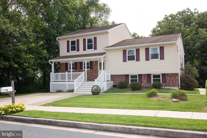 Rarely available Split with 5 Levels in Silvergate Village South.   Entry level with Open Concept Living Room, Dining Room & Kitchen.  Renovated with granite countertops &  expansive breakfast bar island. Complete with French Door style LG refrigerator and  Jenn Aire cooktop & double ovens. Access to the rear covered deck through sliding glass doors in the dining area.  Dining area can easily accommodate a large dining table.
Second level consists of  3 bedrooms & 2 full remodeled baths.  Third Level offers a  primary bedroom with ensuite containing whirlpool, 2 separate vanities & large shower.   This bedroom also offers a walk in closet, balcony & plenty of room for a sitting area.  The lower level offers a family room or potential in-law arrangement with kitchenette, full bath, walk out entry/exit & fireplace.  There is a basement level which provides an additional game room and separate laundry/utility/storage room.   The lot backs backs to a wooded area providing privacy.  Don't miss this unique property in Silvergate Village South.