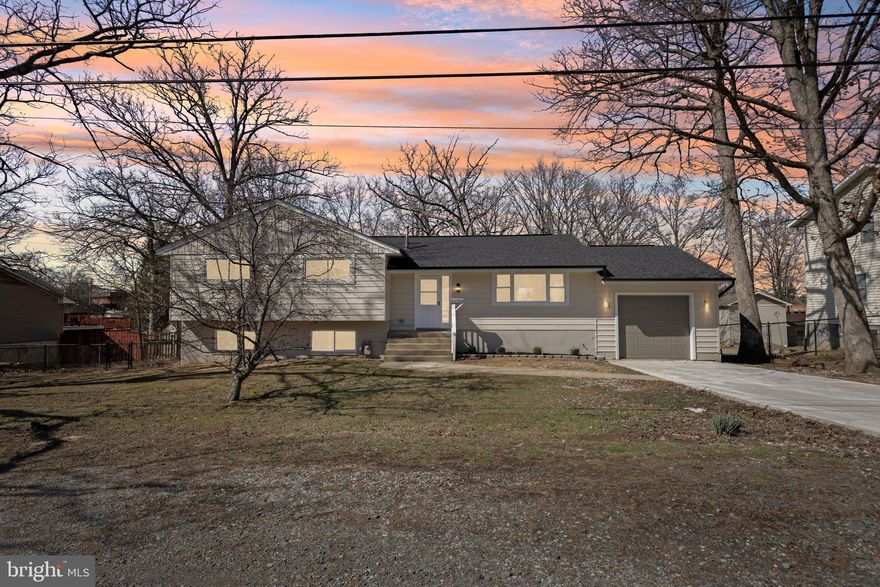 Offer Deadline of Thursday Mar 26th at 12P.  Welcome to Your Dream Home in Lanham, Maryland!
Experience modern living at its finest in this beautifully renovated split-level home, boasting nearly 3,000 square feet of luxury and comfort. Nestled in the heart of Lanham, this residence seamlessly blends style and functionality, ready to welcome you with open arms.
This home exudes elegance with brand-new hardwood floors that grace the main level, creating a warm and inviting atmosphere. The expansive, open-concept kitchen is a chef’s dream, featuring a large kitchen island with a breakfast bar, elegantly adorned with upscale quartz countertops. Cook and entertain effortlessly with the latest stainless steel appliances which include a gas stove and commercial grade range hood to make sure your cooking experience is top notch.
Relax in one of the four spacious bedrooms, including a luxurious owner’s suite complete with an ensuite bath and ample storage space with the dual closets. There are three additional bedrooms and a hall bath as well as a linen closet and extra storage space in the hallway. 
The lower level is a true gem, offering endless possibilities with two more bedrooms, a full bath, and a second kitchen. Ideal for an in-law suite, guests, or rental opportunities, this space is complemented by a spacious recreational room and two bonus areas, perfect for an office, home gym, playroom or movie theater. There is off street parking for 4+ cars and a one car attached garage to keep your car safe from the weather. There is a large deck out back that offers many benefits to enjoy the spring / summer and fall weather as well as a large concrete patio for sitting around a fire pit. The large, flat, rear yard is fully fenced so your furry friends or young kids can run and play and have a safe space to enjoy. 
The neighborhood is super convenient to multiple groceries, as well as retail shopping and multiple restaurants. 495 is a quick drive to commute wherever you have to go.