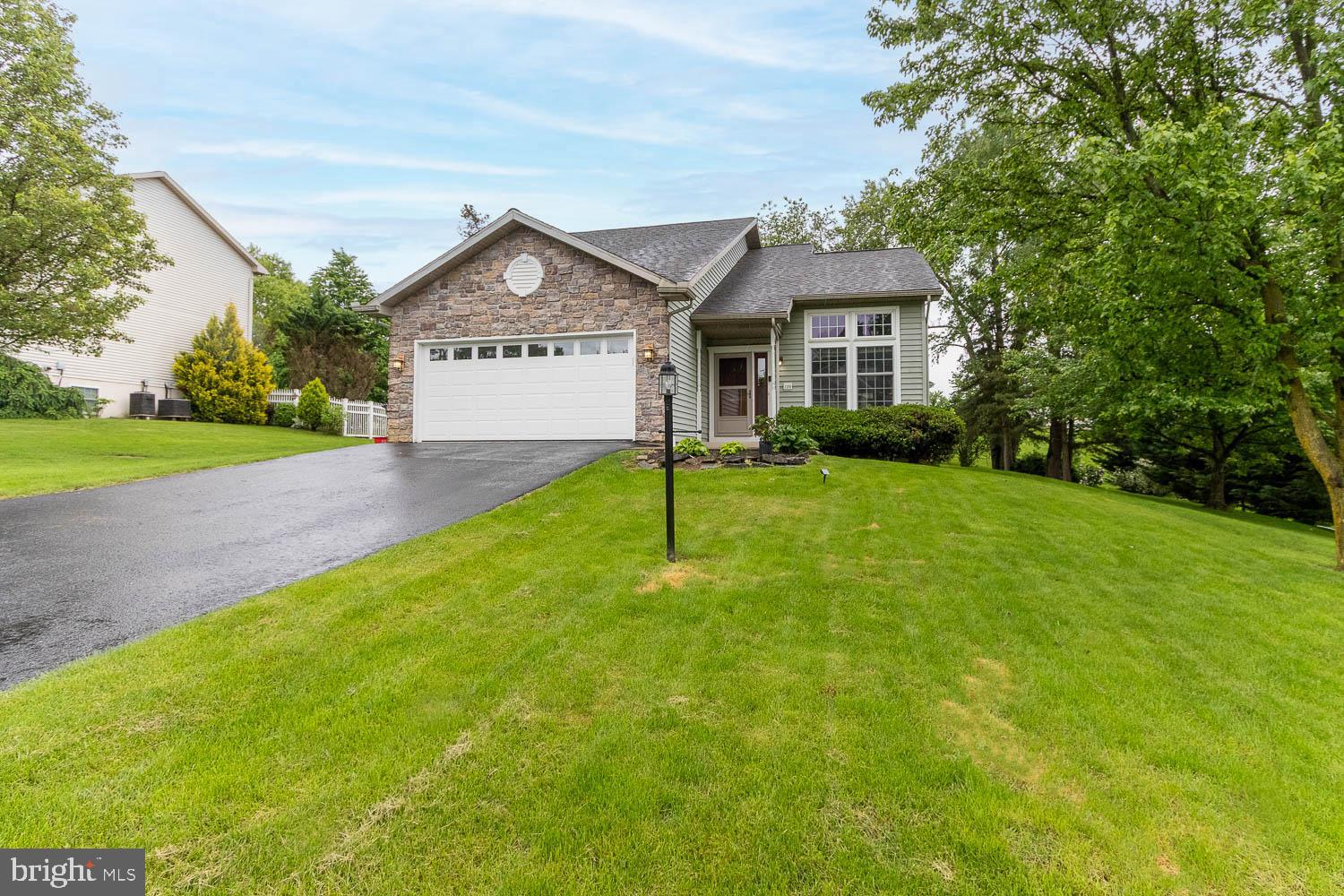 An impressive home in highly sought-after Forest Heights subdivision! Perfectly positioned on .32 acres, this 3 bed, 2.5 bath home boasts eye-catching curb appeal, vaulted ceilings, and a first-floor primary. Once inside the welcoming front door, you are greeted with ample natural light in the living room. You will appreciate the fully-equipped, white kitchen with new stainless steel appliances (2025) and granite countertops that flow nicely into a separate dining area with a glass-sider leading out to an oversized deck with a pergola. The massive first-floor primary bedroom delivers a walk-in closet with built-ins and a private full bath with a dual vanity. Upstairs features two additional bedrooms, one with a walk-in closet, and a full bathroom with a tub shower. Retreat to the partially finished lower level with a sizeable family room and a separate space that can be used as a playroom or office! Additional highlights include first-floor laundry, radon mitigation, central air, attached 2-car garage, and an abundance of storage space. Conveniently located less than 15 minutes to Victorian Bellefonte, 20 minutes to State College + Penn State campus, and 30 minutes to Lock Haven + Lock Haven University.