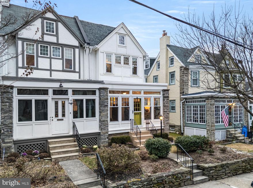 Welcome to 8409 Anderson Street, a thoughtfully updated twin home set in the heart of Chestnut Hill. A bright and charming sunroom welcomes you to the home, offering a versatile space that works equally well as a mudroom or casual sitting room. Inside, the living room features hardwood floors, a gas fireplace, and custom built-ins, and opens naturally into the  dining room, where classic wainscoting,  and generous windows create an inviting setting for everyday meals or gatherings.
The eat-in kitchen has been updated with stainless steel appliances, glass-front cabinetry, and a farmhouse sink, blending character with functionality. Just beyond, a partially covered rear deck provides an easy extension of living space and overlooks the detached, fully fenced backyard - ideal for outdoor dining, gardening, or relaxed entertaining.
Hardwood floors continue throughout the second and third levels. The second floor includes a sun-filled primary bedroom with ample windows and dual closets, along with two additional bedrooms - one featuring built-ins - and an updated hall bath with both a soaking tub and separate shower. The third floor offers two more bedrooms and an additional full hall bath, creating flexible options for guests, home offices, or additional living space.
The finished walk-out basement adds valuable bonus space and includes a half bath, laundry area, and multiple walk-in storage closets. Outside, a garage provides additional storage, and the driveway accommodates two-car off street parking.
Ideally situated just steps from the well-loved shops and cafés along Germantown Avenue, this home also offers convenient access to regional rail, neighborhood parks, and nearby trails. A well-balanced blend of classic character, modern updates, and an exceptional Chestnut Hill location.