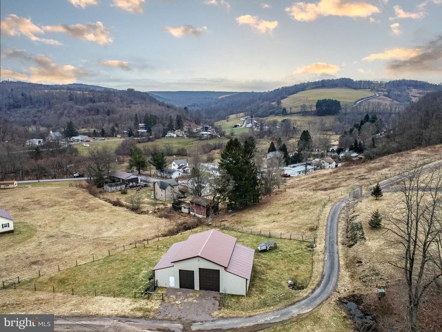 One acre mountain property located just 6 minutes from I-68. Situated on over 1 acre of mountain pasture land, this property features beautiful mountain views, enormous barn with multiple oversized garage doors, two electric meters, high tensile fenced pasture and easy access to all of the areas world class 4 season outdoor recreation. Less than 25 minutes to Deep Creek Lake. Don’t miss your chance to own your piece of mountain Maryland – Call today for details!