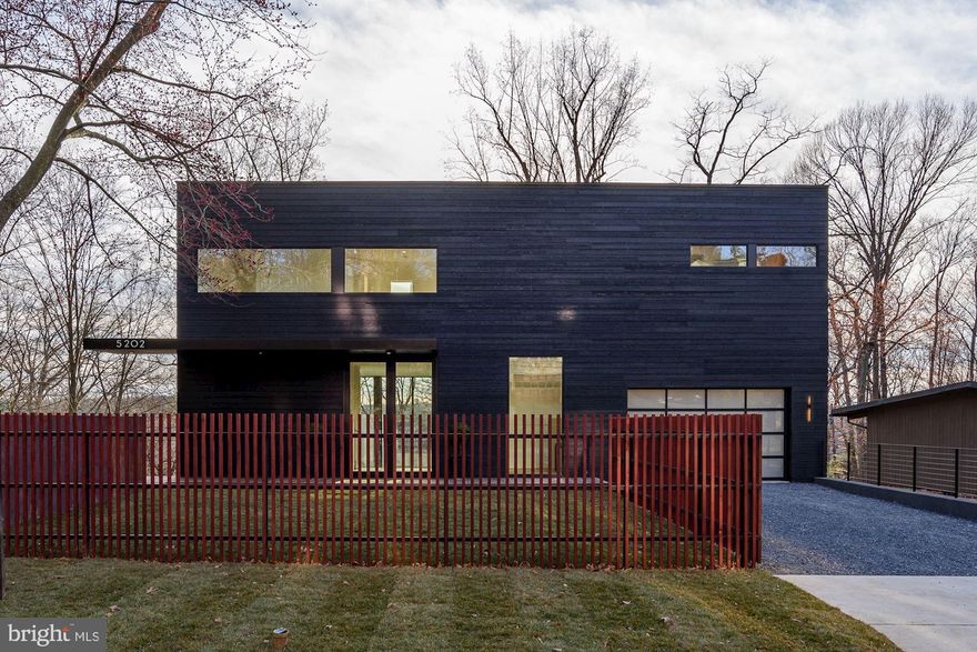 This house has a cool factor of 100!  There simply is nothing else like it......welcome to 5202 Wyoming Road, an exceptional glass and steel Contemporary, perched above the Potomac River.  Designed by award winning architect, Robert Gurney and built by CBD Custom Homes, this 6000+ square foot masterpiece is truly a work of art. A light-filled double circulation axis separates the house's main living spaces and glass and steel bridges cross the circulation volume to connect to the second floor. All primary public and private living spaces have large expanses of commercial grade glass oriented towards the river, while secondary spaces open to the expanse of the front lawn.  The streamlined interior includes custom cabinetry and millwork, hardwood flooring, exposed steel, designer fixtures and more. The exterior Brazilian hardwood horizontal planks, stucco and steel.  Some of the amenities include; double volume great room, floor to ceiling fireplace, oversized 2 car garage with glass doors, study with wall of glass overlooking main level, multiple decks perched on the water, elevator-ready on all levels and so much more. Located just over the DC line, this is one of the best locations in the Metro Area.  Must see to believe.