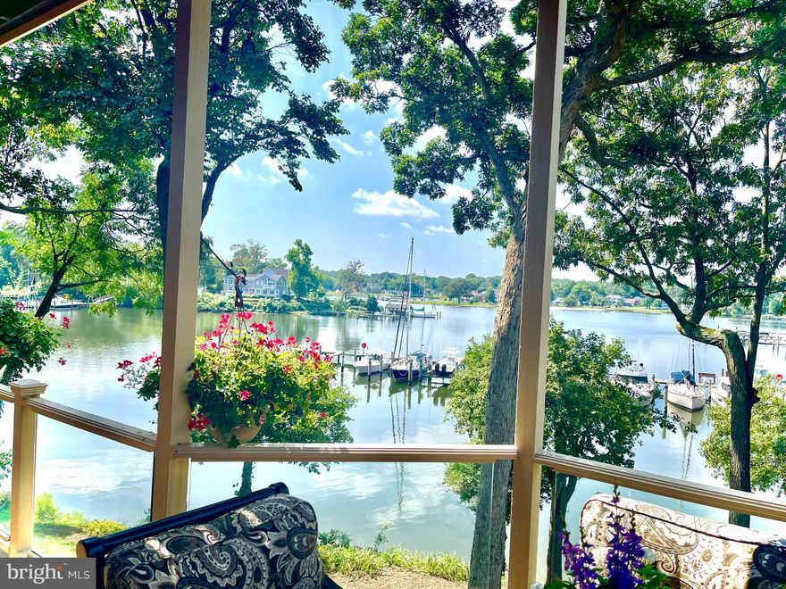 WATERFRONT with EXPANSIVE VIEWS. All Brick Pilli Custom Home sitting just feet from the water.  This is the one you have been waiting for. Three-level outdoor living (decks and Paver patio) overlooking sensational views.  All bathrooms have been remodeled, the kitchen updated, designer paint colors, and Custom Hardwood floors on all three levels (except two bedrooms).  Soaring ceilings and skylights in the living room with a marble surround fireplace.  The dining room has a large floor-to-ceiling bay window framing Almshouse Creek.  The kitchen is open to the family room and has granite counters, stainless steel appliances, and a Viking cooktop.  A unique custom Stone fireplace (wood Burning converted to gas) is the center of attention in the family room. A wet bar holds your favorite drink.  First-floor laundry has a front load washer and dryer with ample storage and a sink with granite.  The Primary bedroom has a wall of windows with water views everywhere, making it hard to get out of bed.  Enormous Private deck off  the primary bedroom.  The Primary bath is completely remodeled and has two sinks, a makeup vanity, an armoire, a spa shower, and a Separate commode area.  The second bedroom is open to the master and used as an office/sitting area but easily converted into a separate room.  The third bedroom has a huge walk-in closet.  The second bath was recently updated.  The lower level has custom hardwoods and an entire brick wall with a wood-burning fireplace.  Wall of windows overlooking water and paver patio with hot tub.  The unofficial 4th bedroom (needs egress) has a cedar closet and built-in vanity.  A large bonus room for a home gym, storage, or workshop finishes off the lower level. Two-car garage with built-in Tesla electric car charger.  50-year warranty cedar roof placed 11 years old.  Fee simple ownership with a condo lifestyle includes 24-hour staffed security, swimming pool, tennis courts, walking paths, total yard maintenance, snow removal, and Professional landscaping in the park-like community surrounded by the South River and Almshouse creek.  This home and South River Landing have it all!  Easy commute to Washington DC, and Baltimore and minutes to Downtown Annapolis by boat or car.