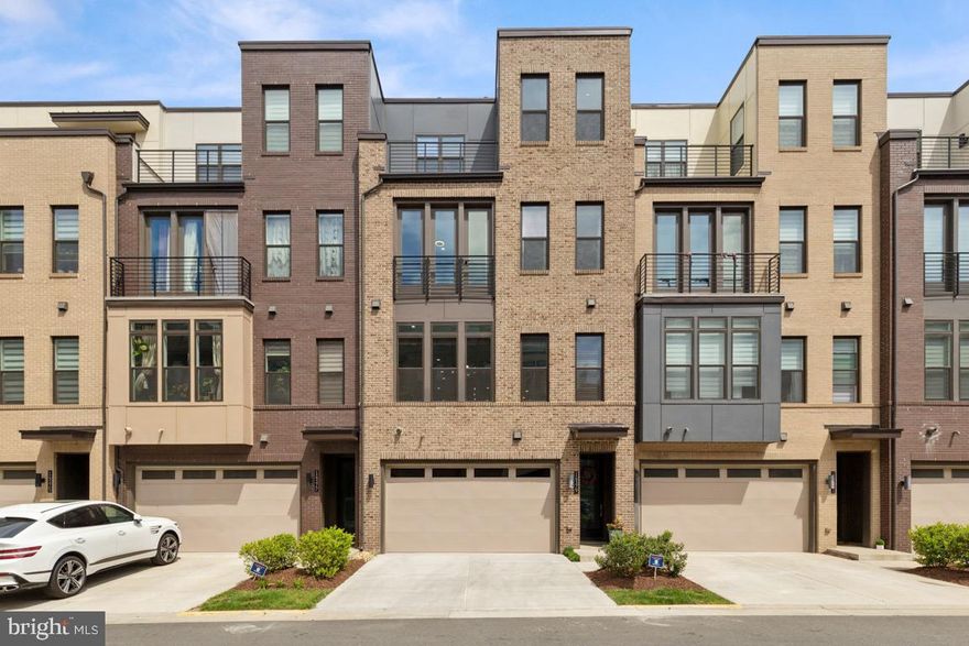 Luxury 4-Level Townhome with 2-Car Garage in Sought-After Commonwealth Place.

Welcome to this stunning Stonecroft model by Toll Brothers, offering over 3,000 finished sq ft across four beautifully designed levels, plus a 2-car garage and two outdoor living spaces. Nestled on a premium lot backing to wooded trails, this home blends luxury, comfort, and functionality.

Thoughtfully Upgraded:
More than $70,000 in upgrades, including over $50K in builder options and $20K+ in custom touches—matte black fixtures, built-ins, and designer hardware throughout.

Lower Level Perfection:
The true walk-out lower level features soaring ceilings, a large rec room with recessed lighting, a full bath, Murphy bed, built-in speakers, and access to the garage with EV charging outlet and storage. Perfect for a gym, rec room, or a potential 5th bedroom.

Main Level Showstopper:
An open-concept layout with designer finishes, a spacious dining area, and a chef’s kitchen boasting a huge center island, granite countertops, vented hood, and a gourmet flow into the living room with gas fireplace and built-in 7-channel surround sound. Oversized sliding glass doors let in amazing natural light, with a custom retractable screen and deck featuring built-in speakers, gas hookup, and hose bib.

 Bedroom Level Comfort:
The primary suite includes a tray ceiling with built-in speakers, plush carpet, walk-in closet, and a spa-inspired bath with upgraded tile, dual shower heads, and body sprays—all with individual controls. Two additional bedrooms, a full bath, and laundry room.

Versatile Loft Retreat:
The top floor features a bonus family room/office/playroom with 5-channel surround, a flex space/potential 4th bedroom , half bath, built ins, wet bar rough-in, and access to a private rooftop terrace with gas hookup, speakers, and water access.

Smart Home Features:
Connected switches, Ethernet ports, and wiring for hotspot access points throughout.

Prime Location:
Located across from Wegmans, Cava, Lazy Dog & more, with easy access to Rt. 28, Rt. 66, Rt. 50, Dulles Toll Road, and Dulles Airport.