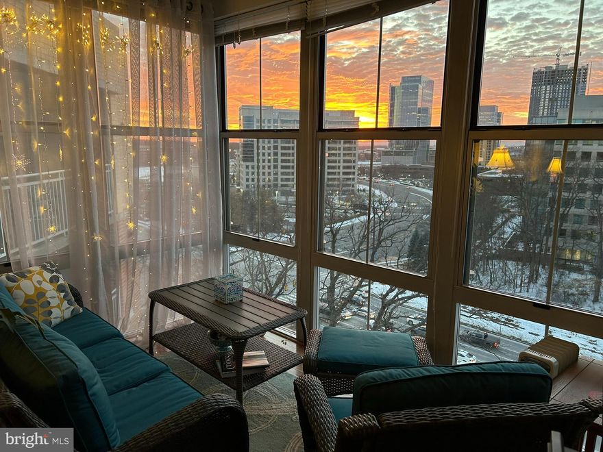 FABULOUS Top Floor Condo with Sunroom AND Balcony offering incredible views to the West and beyond!  Hardwood floors throughout Living and Bedroom space. Granite Countertops and Stainless Steel Appliances. Washer and Dryer in Condo. Top floor offers higher ceilings too. 2 ceiling fans. A walk-in closet plus shelved closet plus coat closet PLUS a storage bin at garage level. One assigned garage parking space plus visitor parking. ENJOY CONVENIENCE and JOY of LIVING in a secure high rise building with front desk concierge in close proximity to Reston Town Center shopping + entertainment, Reston West metro stop, Dulles airport, and extensive path network of Reston and the W&OD trail.  Building AMENITIES include gym with sauna, roof top pool, bike storage areas, rooftop grills and indoor/outdoor dining options, movie theatre, business meeting center, library, cafe, social activities, and more!  Property available for end of May occupancy. Tenant pays electric and gas. Owner condo fee includes water and sewer, parking, and amenities.