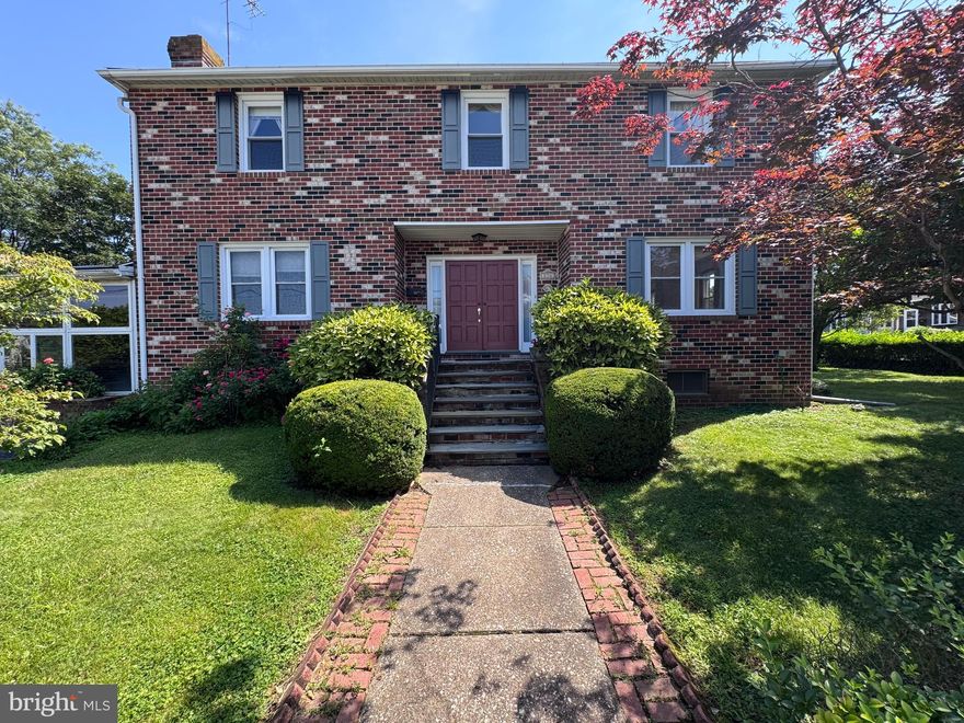 Welcome to 856 Martin Ave, a classic brick Colonial in Bryn Mawr, now refreshed with digital staging to reveal its true potential. This home combines timeless elegance with modern possibilities, set on a coveted corner lot.

The inviting curb appeal features rich brickwork and classic shutters. Inside, the foyer boasts Italian tile, leading to a main level with original hardwood floors, a formal living and dining room, family room, and eat-in kitchen.

The upper level includes four spacious bedrooms, with a primary suite featuring an en suite bath. The finished basement, newly envisioned through digital staging, offers a bar, fireplace, second kitchen, and half bath—ideal for entertaining. The breezeway/sunroom connects to a massive garage, ripe for transformation.

Situated on a large corner lot with two side yards, this home offers privacy and proximity to Bryn Mawr’s finest amenities, with easy access to cafes, shops, parks, and transportation. Whether a serene retreat or vibrant gathering spot, this home is ready for new memories. Experience the possibilities today!