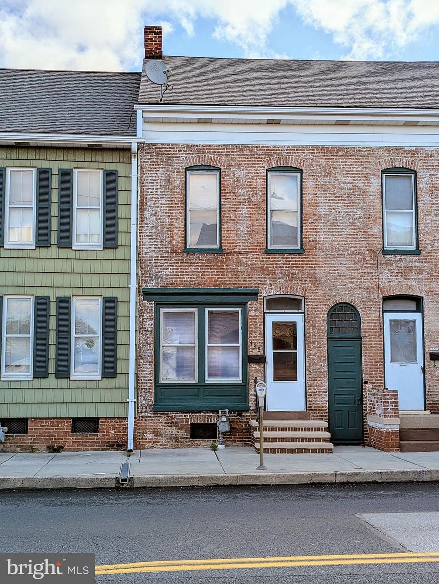 Fresh, clean and move in ready!  Perfect starter home or for that someone that likes the convenience of in town living. Walk to restaurants, shopping and Santas cottage in December. Watch the parades from your own front porch. There is a room that could be a 3rd bedroom or office if you don't mind the walk thru set up. OR easily finish off the attic for another bedroom or family room if needed. The roof is estimated 10 to 12 years old. Freshly painted, the furnace and chimney flue were just cleaned and pipe fittings replaced.  Brand new bathroom. If you're tired of paying rent with no return and being subject to landlord rules and restrictions...at this price it just makes sense. Make it yours and the seller is willing to give 3% seller assist towards closing costs, rate buydown or downpayment for owner occupant.