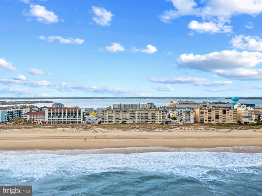 This location cannot be beat! Just steps from the beach and some of Ocean City's best attractions. You will not be disappointed. Enjoy the sunrise on the large balcony then hit the beach. Unwind inside this 2 bedroom 2 bathroom condo with room for everyone. The light, bright large living area encompasses the kitchen, dining and living room with peaks of the ocean. The primary bedroom has its own ensuite. The second bedroom has two sets of bunkbeds to accommodate everyone. Just park your car, in the two assigned parking spots, and enjoy the sun, surf and sand!