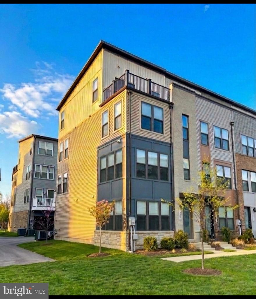 The Executive End-Unit You Won't Find Anywhere Else.
Upgrade your expectations with this truly exceptional 4-level end-unit, designed with attention to detail. This isn't just a townhouse—it’s a curated residence featuring over $30,000 in thoughtful upgrades and a functional floorplan that others only claim to have.

While neighboring homes offer open lofts, this home features a True 4th-Level Penthouse Suite—complete with a private door, closet, and full en-suite bath. Perfect as a primary retreat, guest wing, or the ultimate home office, this is a legitimate 4-bedroom home (4 Beds, 3 Full/2 Half Baths).

The Chef’s Kitchen Reimagined: The main level is a showstopper, anchored by a gourmet kitchen with modern cabinetry, granite countertops extended as a matching backsplash, and a premium upgraded appliance package that includes two smart ovens. Enjoy seamless entertaining under sparkling pendant lights, with soft-close cabinets and drawers in the kitchen and all bathrooms.

Smart Luxury, Integrated: The technology in this home is invisible but impactful. Features include:
Upgraded LVP flooring and carpeting throughout.
Recessed lighting added to bedrooms, kitchen, living, and dining.
Top-down/bottom-up blinds on every window; Blackout blinds in all bedrooms.
Ceiling fan pre-wires in all bedrooms, living, and dining rooms.
Pre-installed wall mount for television with high-outlet cord hiding.
An Internet booster on the 4th floor for a seamless connection.
Upgraded bathroom fixtures, shower heads, and a custom glass shower door.
Smart washer and dryer included!

The Waterfront Setting: Step onto your private rooftop terrace and take in tranquil views of the neighborhood pond—a view only available to select end-units. With the Northwest Branch River Trail just outside your door and a 5-minute walk to the West Hyattsville Metro, you have reached the pinnacle of transit-oriented luxury. More privacy, more bathrooms, and better views. Schedule your tour of 5600 Hyattsville today!