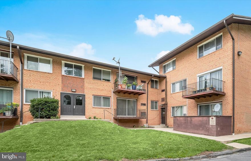 Beautifully updated condominium showcases a renovated kitchen and stylishly remodeled bathroom. A sun-drenched open layout offers distinct living and dining areas, enhanced by a coffered accent wall, modern cage chandelier, and sliding glass doors leading to a private balcony with serene, tree-lined views. The kitchen impresses with white shaker cabinetry, granite countertops, and stainless steel appliances. Two generously sized bedrooms provide comfort and flexibility, while a sleek barn door reveals a chic bathroom adorned with designer tile accents. Ideally located near shopping, dining, entertainment, and major commuter routes for ultimate convenience.