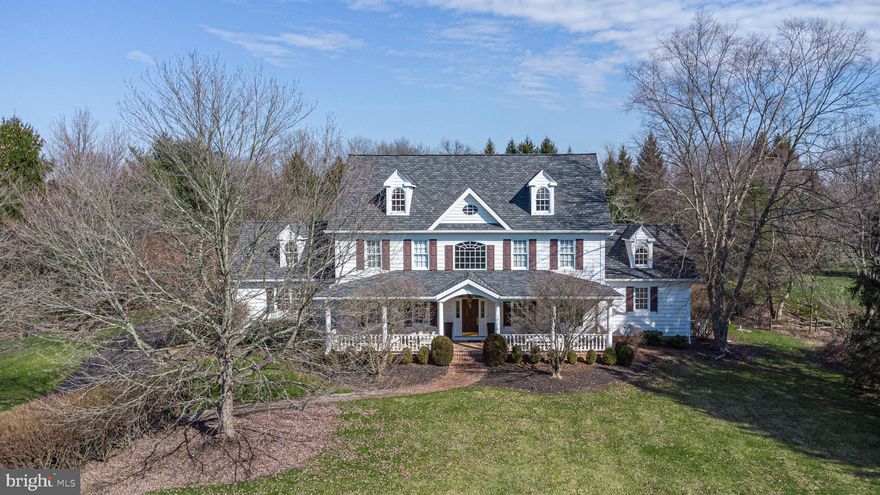 Situated in an exclusive enclave of only 7 custom homes with lush, mature landscaping is this elegant Ferman Lex masterpiece. As the largest home in the community, this refreshed and sophisticated estate offers beautiful architectural details and wonderful space for the discerning buyer. The stage is set with the expansive covered front porch with charming brick floor reminiscent of a southern veranda. A gracious, open plan highlighting a gorgeous, updated Charles Weiler Gourmet Kitchen with Wolf stove, custom hood, Bosch ovens and dishwasher, white cabinets and contrasting island, sleek Butler’s pantry and bright breakfast area with customized pantry and drink station leading into the 2 story Great Room with beautiful Palladian window. The spacious Main Floor Bedroom Suite includes doors out to the expansive brick and flagstone patios. The updated Main Bath features a freestanding tub, separate vanities with Quartz counters and huge walk-in closet with professional organizers. The upper level boasts 4 sizeable bedrooms, one en-suite, and over 1000 square feet of additional living space to include a kitchenette, living area and full bath with own private outdoor entrance allowing for wonderful flexibility. The Lower Level is finished to include a bar, billiards area, outfitted gym with 2 corner TVs, full bath and an exceptional 2 level theater room. Additional amenities include a large formal Dining Room, hardwood floors throughout, a newer roof, generator, solid wood doors, third floor attic perfect for storage, oversized 3 car garage, a private outdoor hot tub area and a firepit. The 1.5 acre lot offers privacy and versatility all within a quaint community setting in the award-winning and highly desired New Hope – Solebury school district.