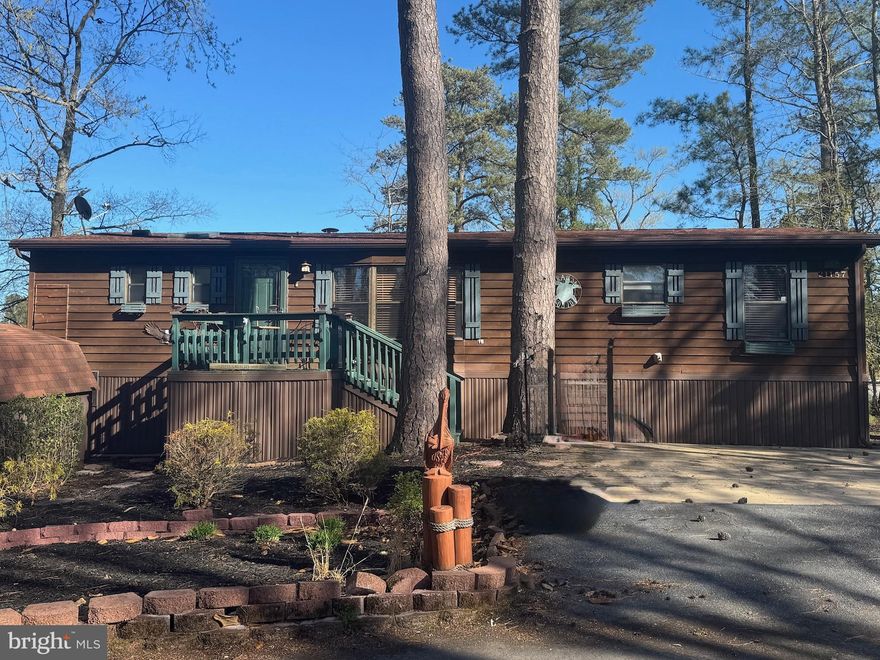 Welcome to your cabin at the beach!  This home is located in the desirable water accessible Leased Land community of Rehoboth Bay. Tranquility awaits you with this home being positioned at the end of a cul-de-sac. The three seasons room is the perfect place to grab your Binoculars and bird watch over the wetlands. There are 3 good size bedrooms, 2 full baths, both with step in showers and 1 with a soaker tub,  updated kitchen with beautiful quartz countertop, pantry closet, newer appliances and easy maintenance vinyl flooring through most of the home.  HVAC/heat pump is approximately 2 years old, roof approximately 8 years old.  Monthly rent of $886.00 includes, water/ trash. Community amenities include, boat slips for rent, a community boat ramp, a boat storage area, a bayfront pool, a crabbing/fishing pier, a small sandy beach near the pool, tennis/pickleball courts and a whole lotta fun!  You are just a short drive  to the famous Rehoboth boardwalk, shopping outlets and a multitude of eateries.  Interested Buyer will have to make application with the community and pass a credit / background check.  Settlement costs will include 1/2 of a 3.75% DMV transfer fee, a settlement agent fee of appx $400 and any other expenses associated with this home will be pro-rated to the day.