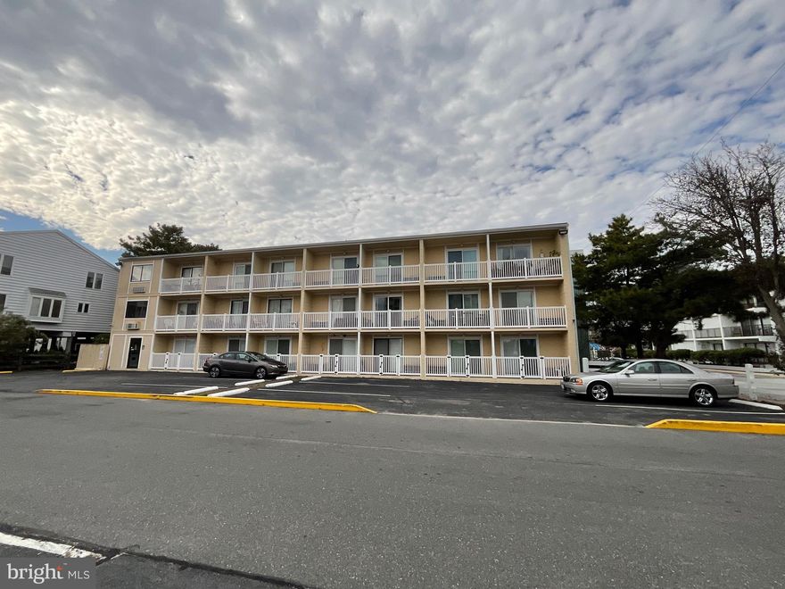 Looking for a place to lay your head and have the Ocean in sight of your condo???  That's what you will get in this efficiency unit on the 3rd floor located  on 62nd St (at the foot of the Rt. 90 Bridge) right behind "Denny's American Diner".  This is a 3 story building and the unit is on the 3rd floor with a view of the Atlantic Ocean off your private balcony.  The slider to the balcony was replaced  in about 2017 with a Hurricane glass heavy duty slider.  The A/C  and heat was replaced  inn 2018 and is a ductless unit.  Condo comes furnished.  This mid-town building features an out door pool, a 1st floor laundry facility for condo owners, and the amount of parking is exceptional.  The wall next to the bed has insulation and covered with material.  Insulation reduces sound.  Affordable living in a mid town location, the best of everything for only $169,900.  Make your appointment today to see this condo.